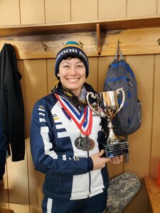 Alaska National Guard Staff Sgt. Anna Knopes holds up her trophy from the Annual Chief of the National Guard Biathlon Race at Camp Ripley, Minnesota, from Feb. 12-15, 2022. The AKNG team took first place overall in the women's division during this year's competition. (Courtesy photo)