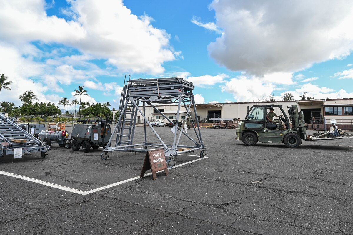 Airman 1st Class Jaylen Alberts, 647th Logistics Readiness Squadron ground transportation journeyman, operates a forklift while transporting 15th Maintenance Group equipment during Exercise TROPIC FURY at Joint Base Pearl Harbor-Hickam, Hawaii, March 1, 2022. The 647th LRS is responsible for loading and unloading passengers and cargo in support of airlift operations. (U.S. Air Force photo by Staff Sgt. Alan Ricker)