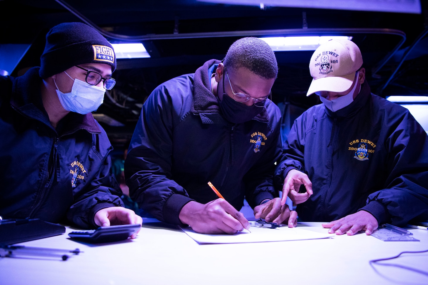 PACIFIC OCEAN (March 1, 2022) Sailors assigned to the Arleigh Burke-class guided-missile destroyer USS Dewey (DDG 105) plot maneuvering board solutions in the Combat Information Center while participating in bilateral advanced warfare training (BAWT). BAWT is an annual bilateral training exercise that improves the partnership between U.S. and Japanese Forces. This year’s exercise focused on enhancing readiness and interoperability of coalition forces from the U.S. and Japan Maritime Self-Defense Force. (U.S. Navy photo by Mass Communication Specialist 1st Class Benjamin Lewis)