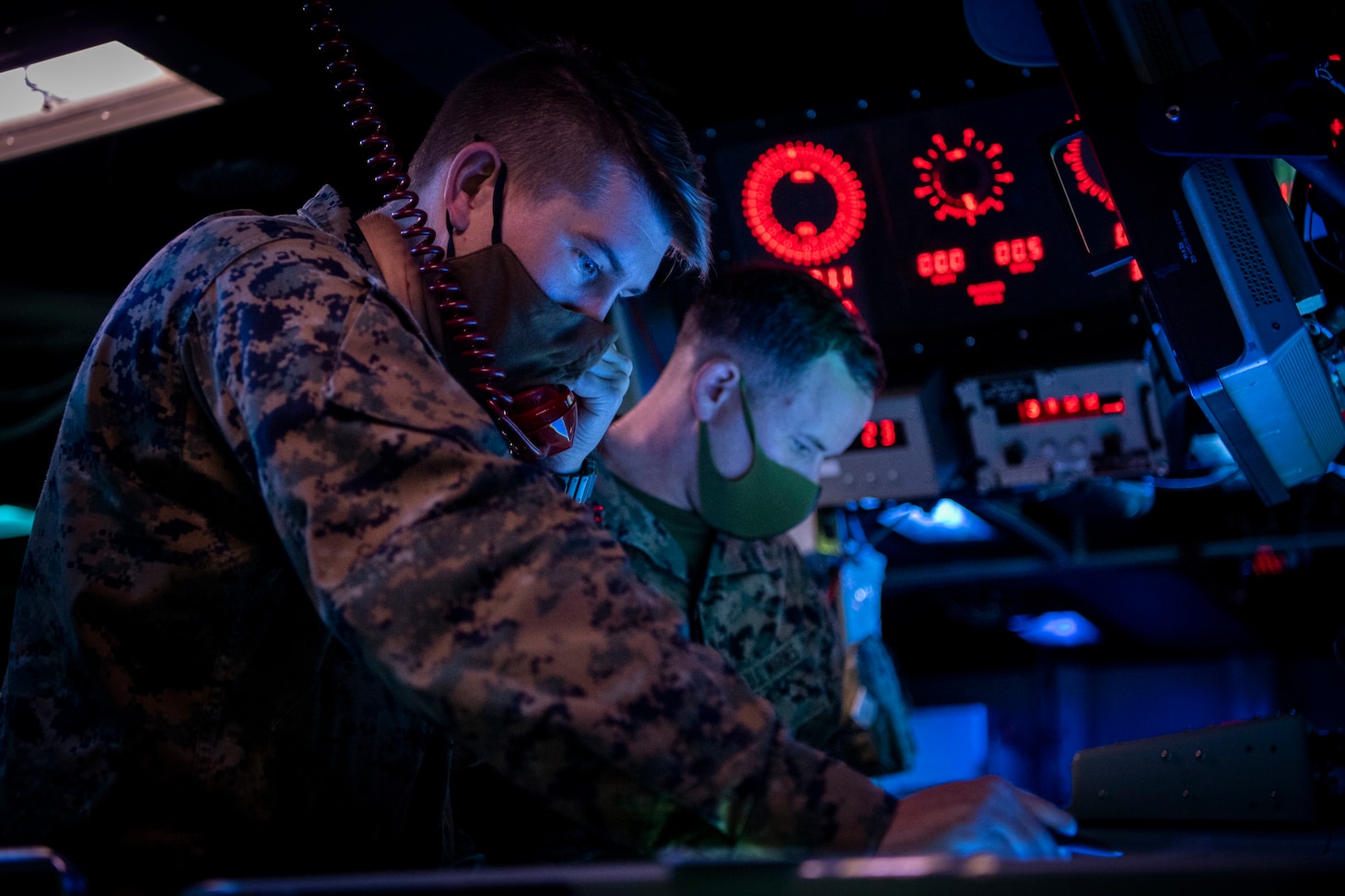 PACIFIC OCEAN (March 1, 2022) U.S. Navy Lt. Dillon Duke, left, from Edmond, Oklahoma, and U.S. Marine Capt. Austin Branch, from Coronado, California, both assigned to the U.S. Marine Corps Fifth Air Naval Gun Liaison Company (5th ANGLICO), simulate Naval Surface Fire Support (NSFS) with the Japanese Ground Self-Defense Force (JGSDF) in the Combat Information Center aboard the Arleigh Burke-class guided-missile destroyer USS Dewey (DDG 105) while participating in bilateral advanced warfare training (BAWT). BAWT is an annual bilateral training exercise that improves the partnership between U.S. and Japanese Forces. This year’s exercise focused on enhancing readiness and interoperability of coalition forces from the U.S. and Japan Maritime Self-Defense Force. (U.S. Navy photo by Mass Communication Specialist 1st Class Benjamin Lewis)