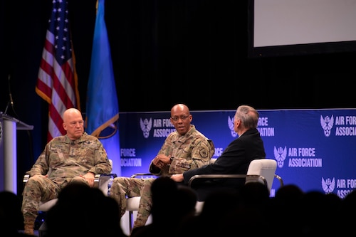 Chief of Space Operations Gen. John W. “Jay” Raymond, left, and Chief of Staff of the Air Force Gen. CQ Brown, Jr., center, address attendees at a fireside chat during the Air Force Association’s Air Warfare Symposium in Orlando, Fla., March 3, 2022. The discussion, ‘Airmen and Guardians in the Fight,’ encompassed topics to include modernization, sustaining readiness, expeditionary abilities and more, with focus on placing the power in the hands of young Airmen and Guardians. (U.S. Air Force photo by Staff Sgt. Elora J. McCutcheon)