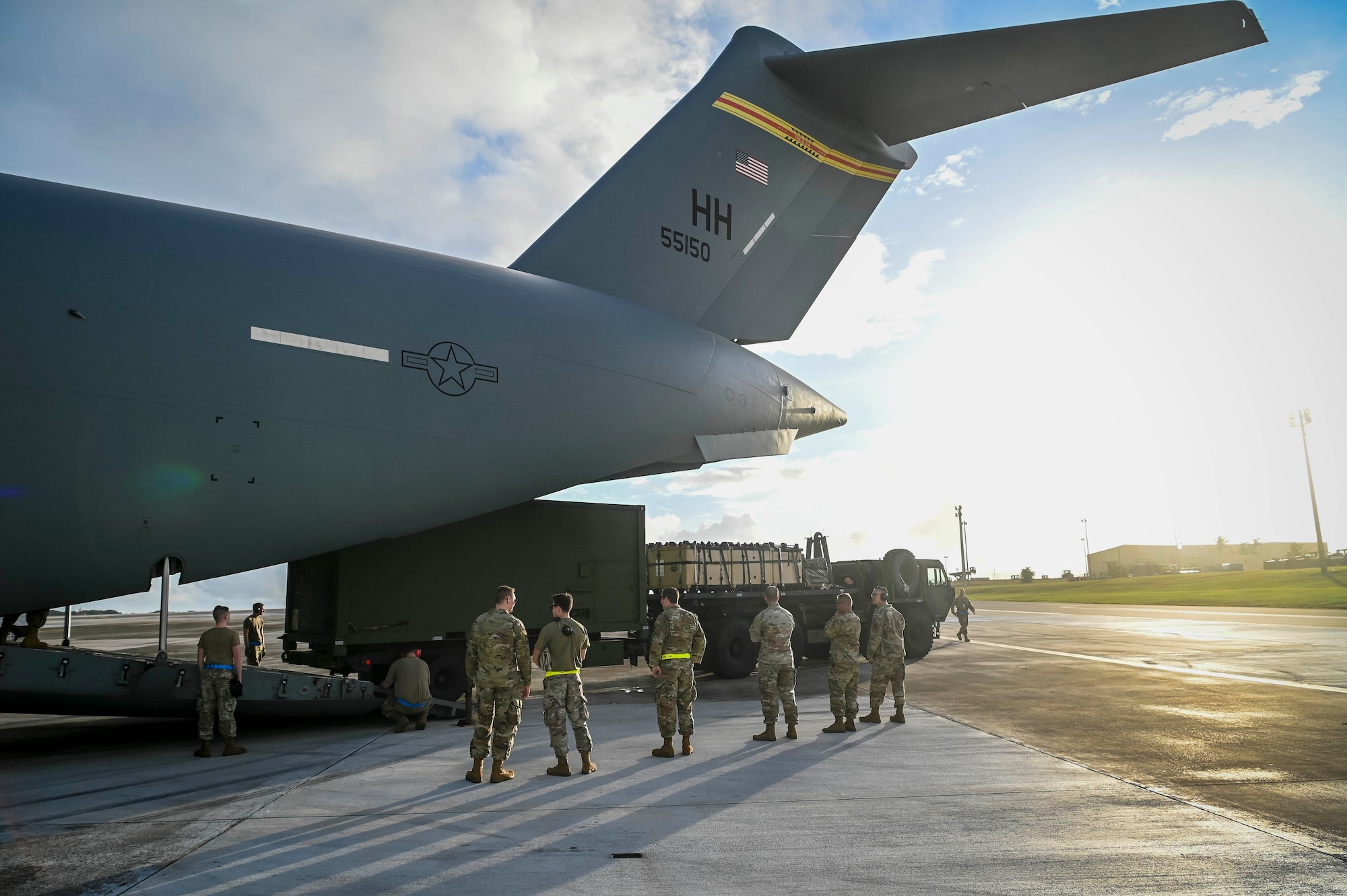 U.S. Air Force Airmen from Joint Base Elmendorf-Richardson, Alaska, and Joint Base Pearl Harbor-Hickam, Hawaii, load the Terminal High-Altitude Area Defense, assigned to Task Force Talon, equipment onto a C-17 Globemaster III during Operation Talon Lightning on Andersen Air Force Base, Guam, March 4, 2022.