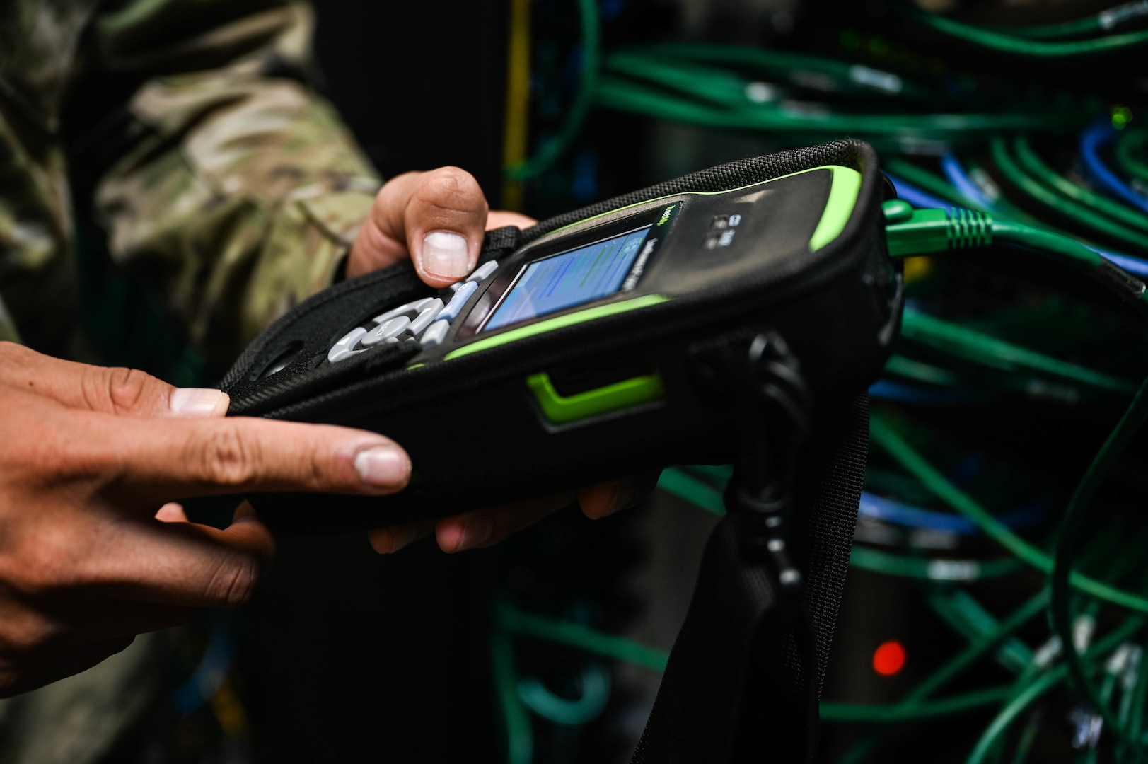 Staff Sgt. Deangelo Johnson, 15th Medical Group Medical Information Systems Flight noncommissioned officer in-charge, utilizes a LinkRunner AT 2000 to test network port activations at Joint Base Pearl Harbor-Hickam, Hawaii, Feb. 24, 2022. The LinkRunner enables MIS personnel with the ability to test network connectivity through the MDG to ensure they meet mission requirements. (U.S. Air Force photo by Staff Sgt. Alan Ricker)