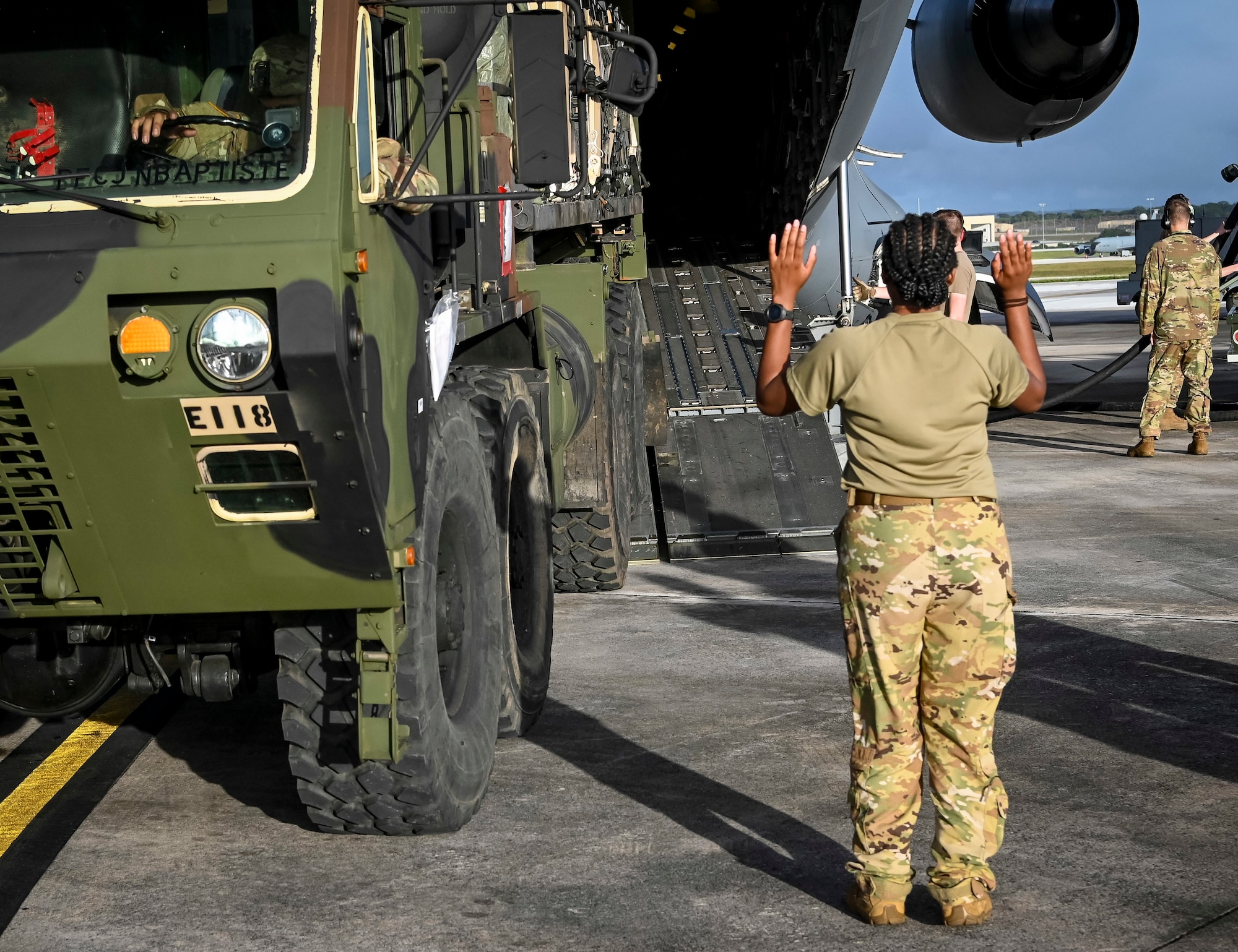 U.S. Air Force Airman 1st Class Taylor Williams, loadmaster assigned to the 535th Airlift Squadron, Joint Base Pearl Harbor-Hickam, Hawaii, load the Terminal High-Altitude Area Defense, assigned to Task Force Talon, equipment onto a C-17 Globemaster III during Operation Talon Lightning on Andersen Air Force Base, Guam, March 4, 2022.