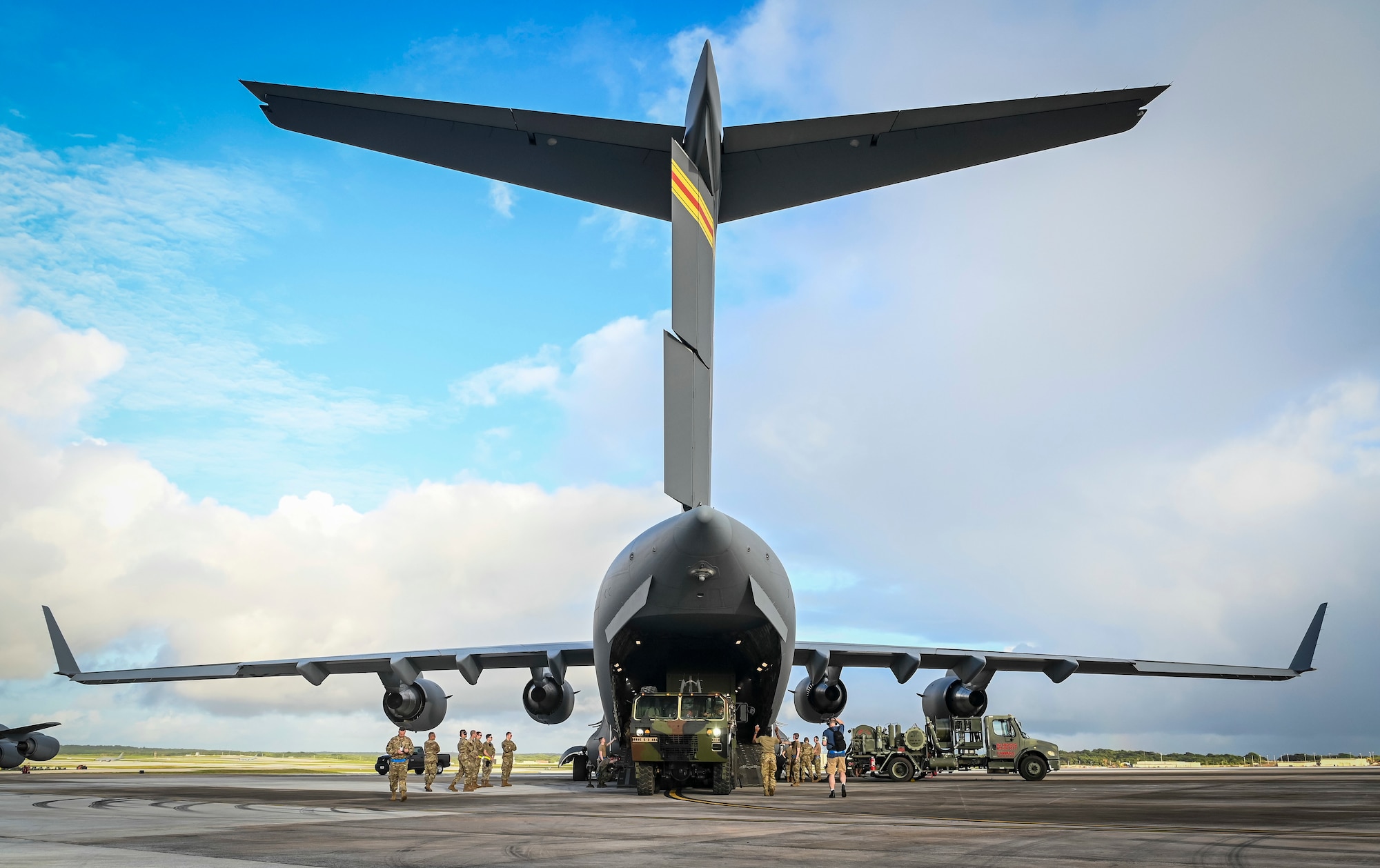 U.S. Air Force Airmen from the 732d Air Mobility Squadron and the 735th Air Mobility Squadron, located at Joint Base Elmendorf-Richardson in Alaska and Joint Base Pearl Harbor-Hickam in Hawaii, load Terminal High-Altitude Area Defense equipment onto a C-17 Globemaster III on Andersen Air Force Base, Guam, March 4, 2022.