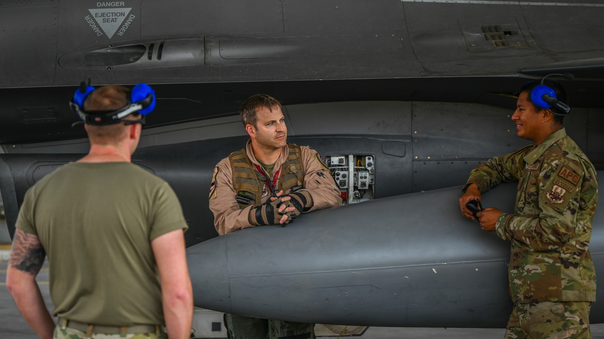 A 176th Expeditionary Fighter Squadron pilot, conducts a pre-flight brief with his maintenance team in preparation for take off at King Abdulaziz Air Base, Kingdom of Saudi Arabia, Feb. 17, 2022.  The 378th AEW deployed a small detachment of Airmen from various Air Force specialty codes to meet the needs of a forward operating base. (U.S. Air Force photo by Staff Sgt. Christina A. Graves)