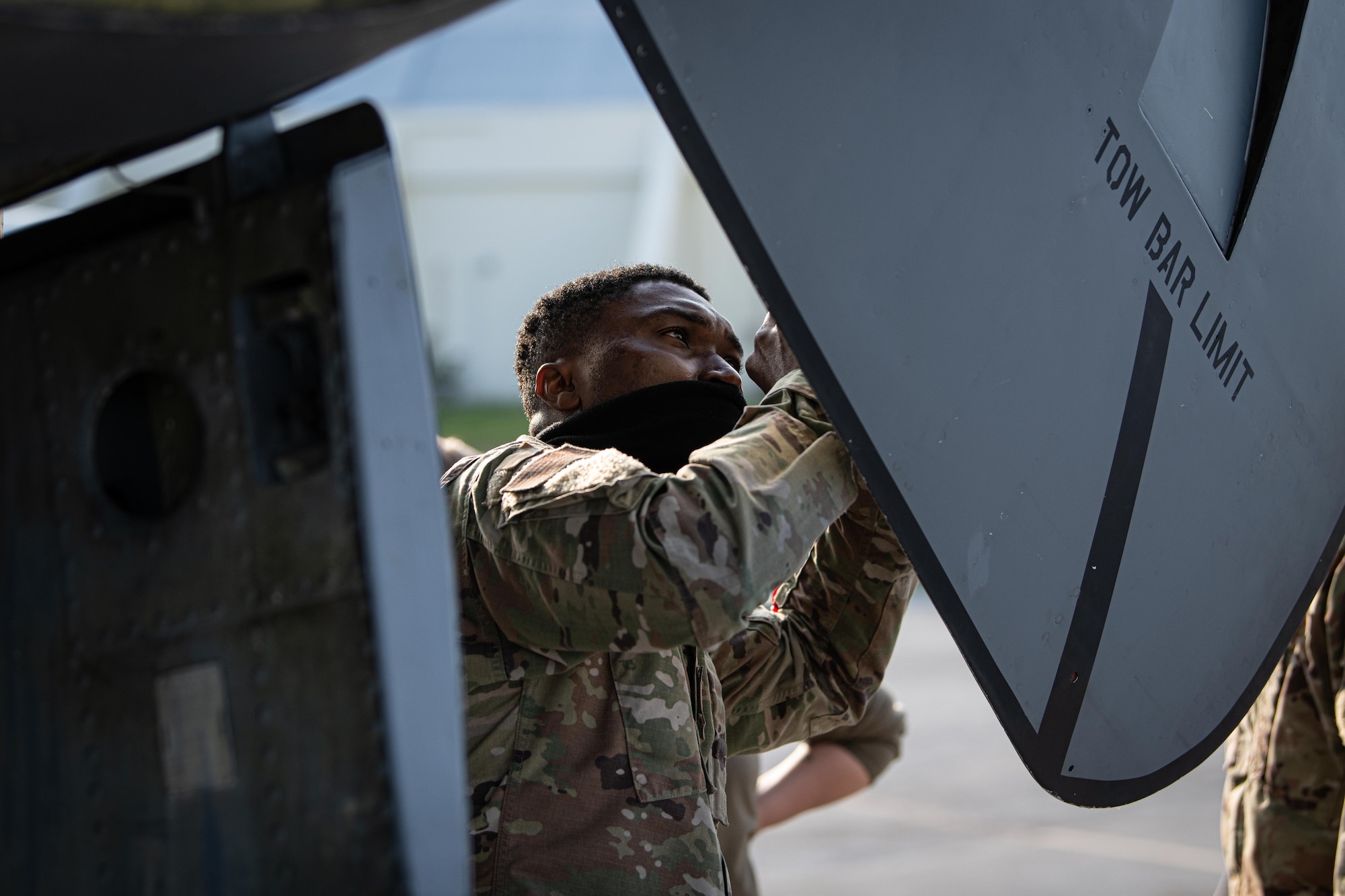 Airmen checks door.