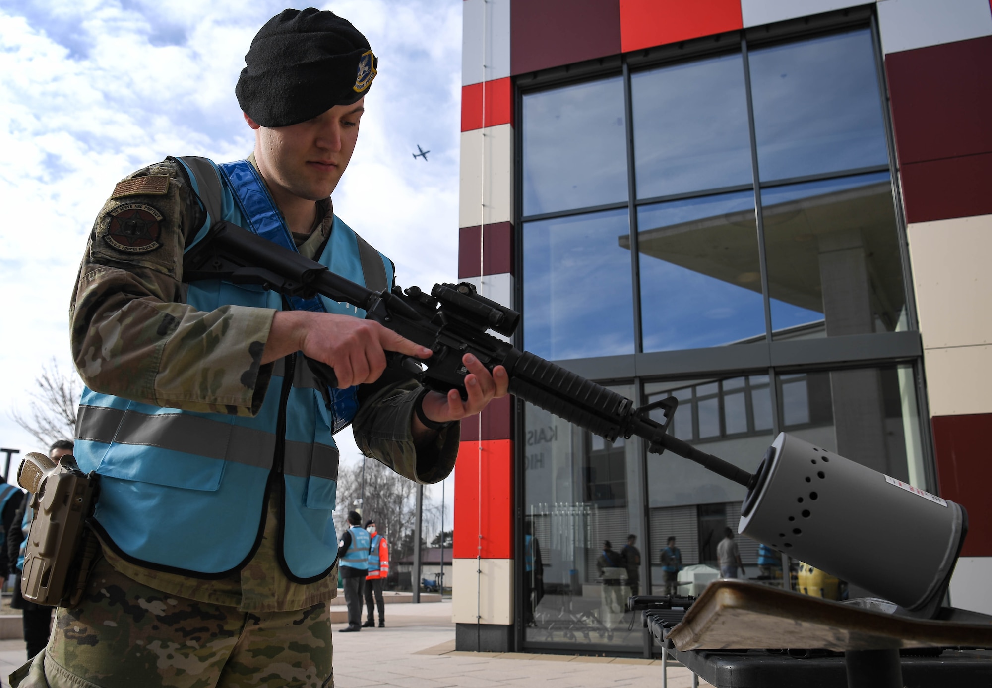 U.S. Air Force Nathan Craddock, 569th United States Forces Police Squadron standardization and evaluations, clears out the magazine well of a M4 Carbine during exercise Operation Varsity 22-1 which simulated an active shooter threat at Vogelweh Air Base, Germany, March 1, 2022. To ensure the safety of all participants in this exercise, no live-rounds were used. (U.S. Air Force photo by Airman 1st Class Jared Lovett)