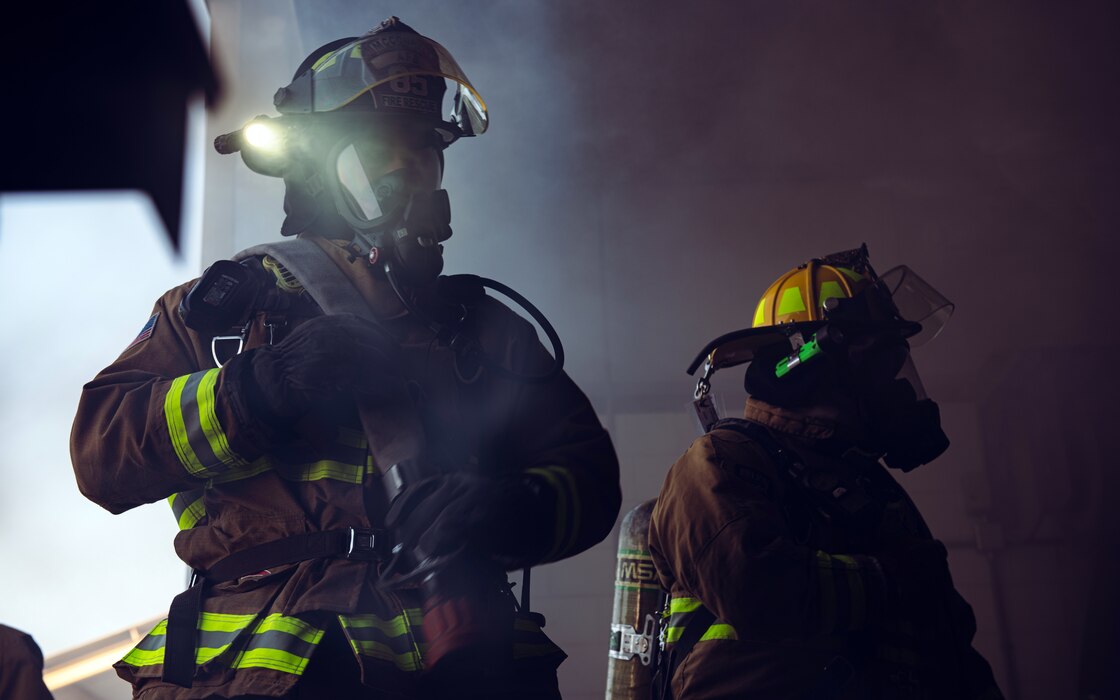 U.S. Air Force firefighters assigned to the 379th Expeditionary Civil Engineer Squadron simulate putting out a structure fire