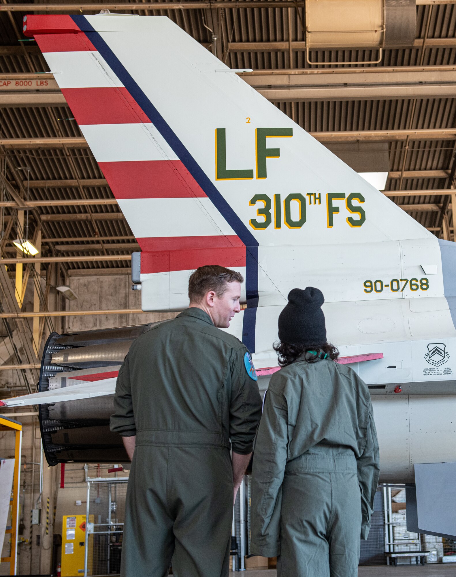 Ian “Monky Warrior” Brito, Pilot for a Day participant, receives a tour of an F-16 Fighting Falcon from Capt. Sebastian Hill, 310th Fighter Squadron pilot, Feb. 25, 2022, at Luke Air Force Base, Arizona.