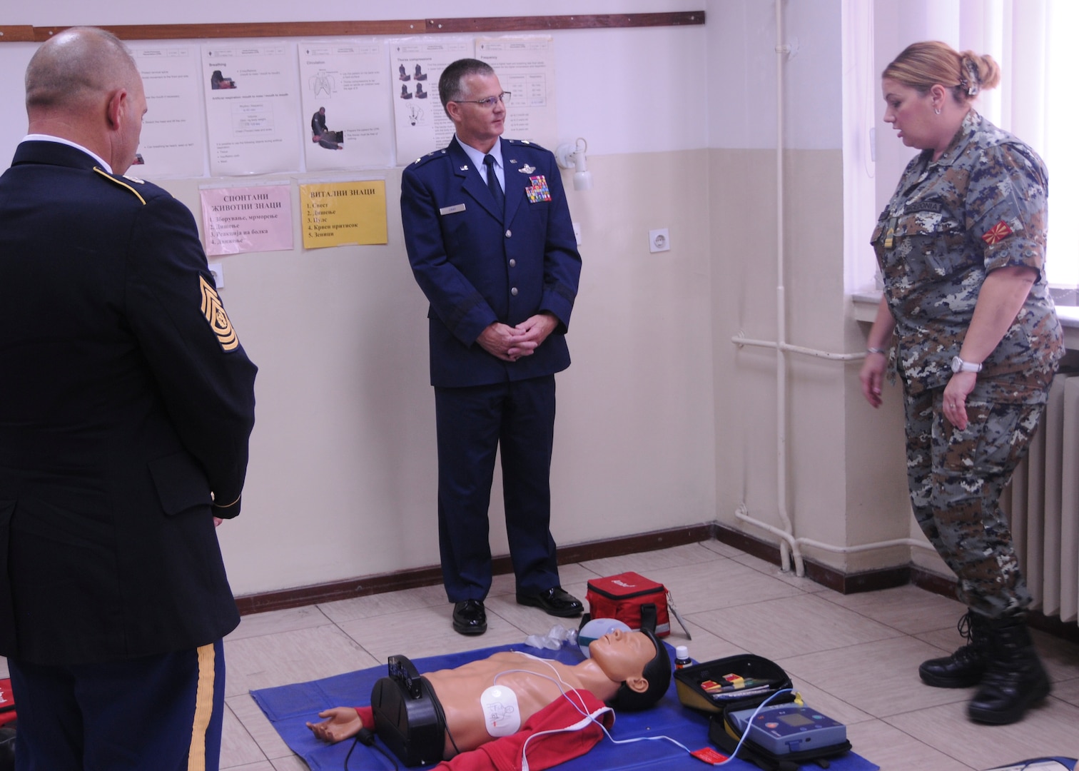 Maj. Gen. Steven Cray and State Command Sgt. Maj. Toby Quick receive a briefing from a soldier in the Army of the Republic of Macedonia. Macedonia's Army Medical Unit has Role 2 medical capabilities and will probably be the focus of the tri-lateral engagement between Macedonia and Senegal, Vermont's two State Partnership Program countries, Sept. 22, 2014. (U.S. Air National Guard Photo by Capt. Dyana Allen)