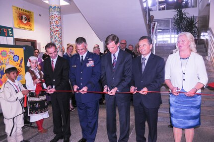 Maj. Gen. Steven Cray, the adjutant general of the Vermont National Guard (center left) and Ambassador Paul Wohlers, the U.S. Ambassador to Macedonia, (center) attend a ribbon cutting ceremony at a school in the Municipality of Illinden that was part of USAID's Interethnic Integration in Education Program (IIEP), Sept. 23, 2014. Maj. Gen. Steven Cray represented US EUCOM J4 and spoke about the importance of shared cultural diversity. (U.S. Air National Guard photo by Capt. Dyana Allen)