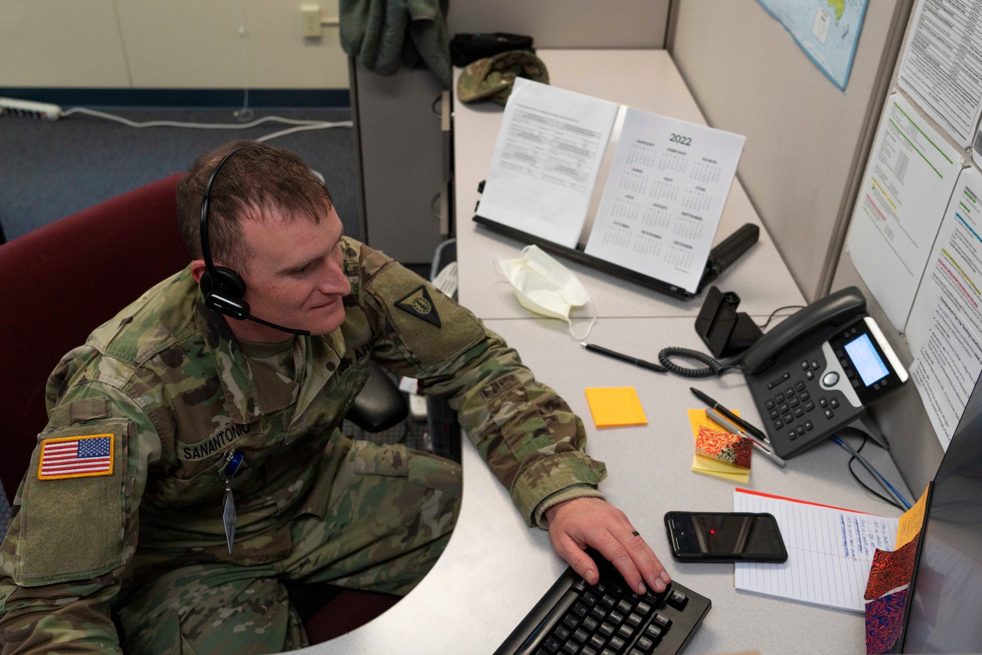 Staff Sgt. Steven San Antonio of the 195th Regional Training Institute answers a call Feb. 14, 2022, at the St. Joseph COVID triage call center in Nashua, New Hampshire. San Antonio is one of two New Hampshire Guardsmen assigned to the center as part of Operation Winter Surge.