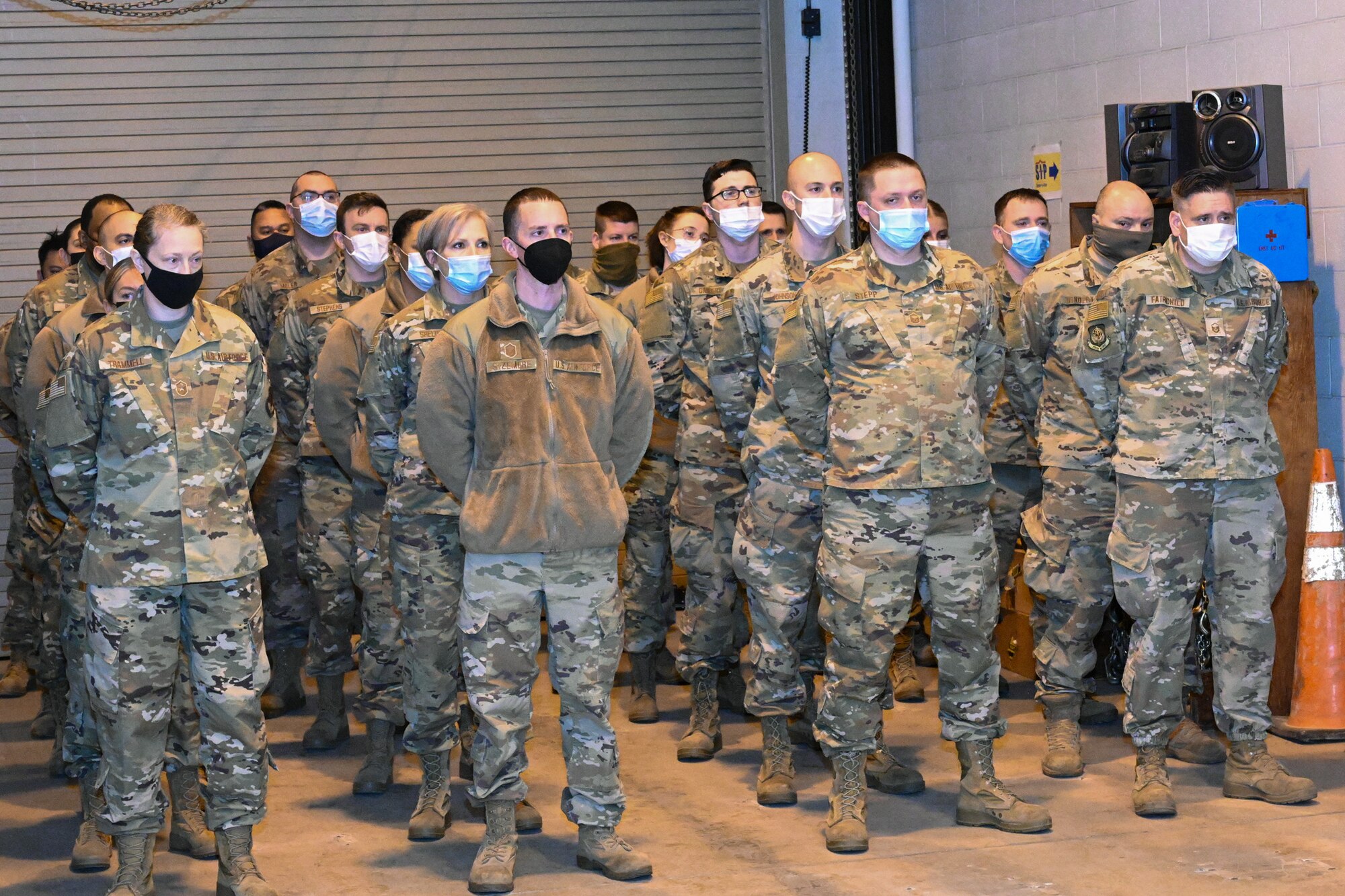 Members from the Small Air Terminal, Maryland Air National Guard, stand in formation as they watch the deactivation ceremony Feb. 12, 2022, at Warfield Air National Guard Base, Middle River, Maryland. The 135th Aerial Port Flight was part of the Maryland Air National Guard from 1976, when it was activated at Martin State Airport, to 2008. Due to a decrease in personnel, the 135th APF transitioned to the Small Air Terminal, under the 175th Logistics Readiness Squadron. (U.S. Air National Guard photo by Senior Airman Danielle Lofton)