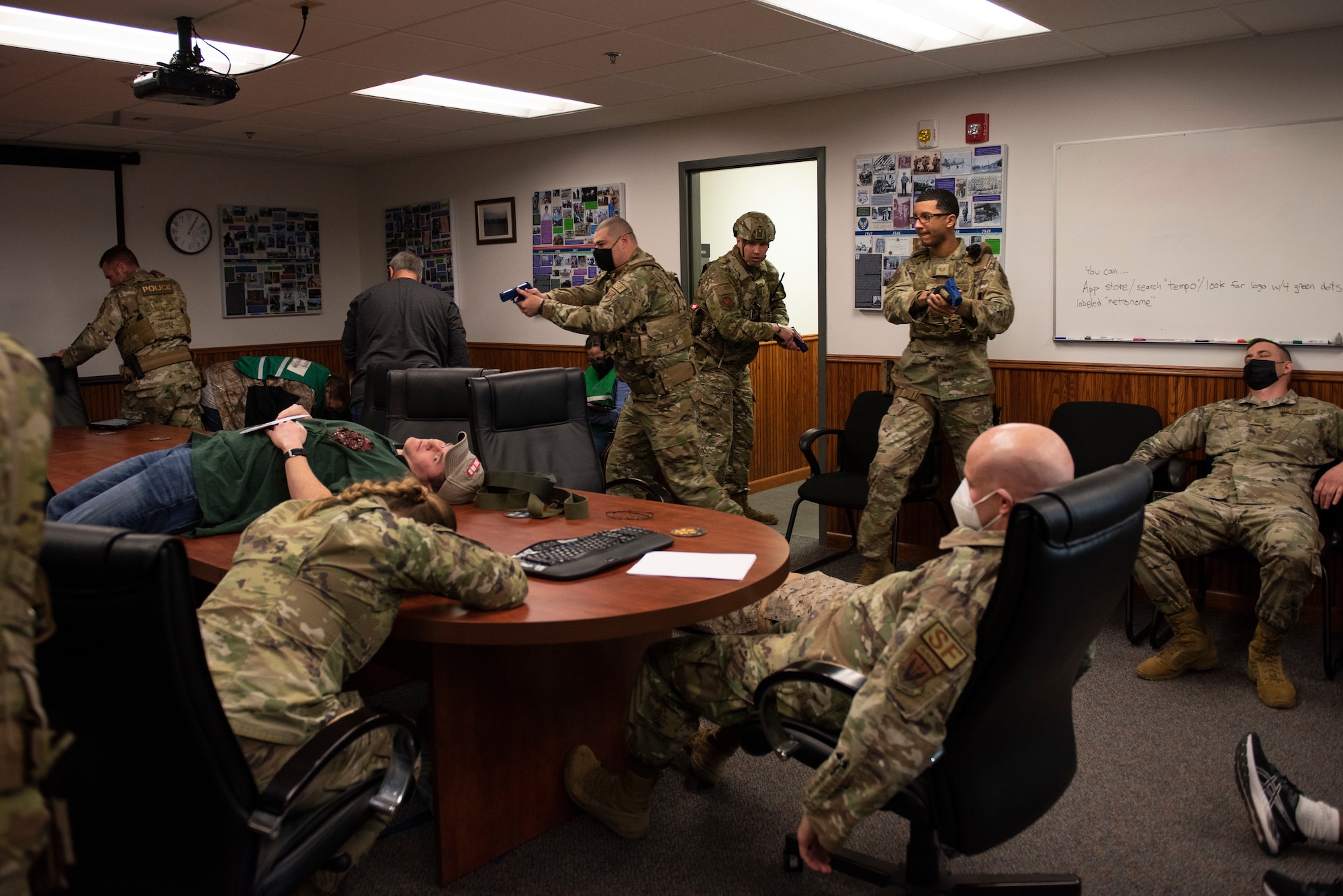 A group of 366th Security Forces Airmen enters a room of simulated casualties