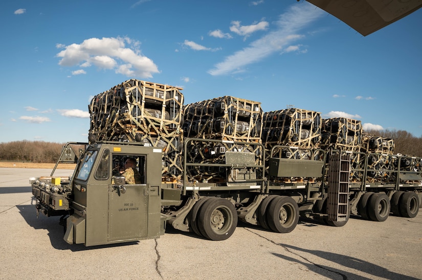 A cargo vehicle hauls pallets of material.