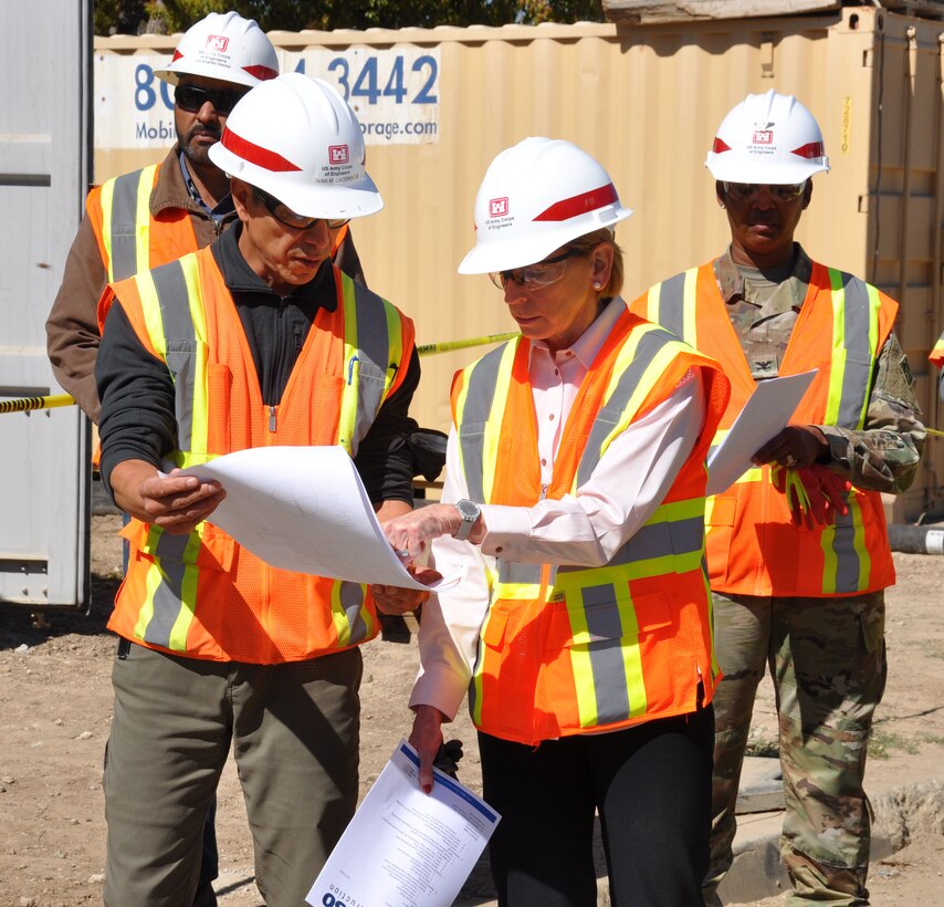 Dr. Christine Altendorf, director of Military Programs for Interagency and International Services, U.S. Army Corps of Engineers, Headquarters, right, speaks with Ivan Caceres, quality assurance representative with the U.S. Corps of Engineers Los Angeles District for the Long Beach VA mental health facilities’ construction, left, about the project Feb. 24 in Long Beach, California. Upon completion, the state-of-the-art mental health in-patient and out-patient facilities, along with a Community Living Center, will serve veterans and warfighters.