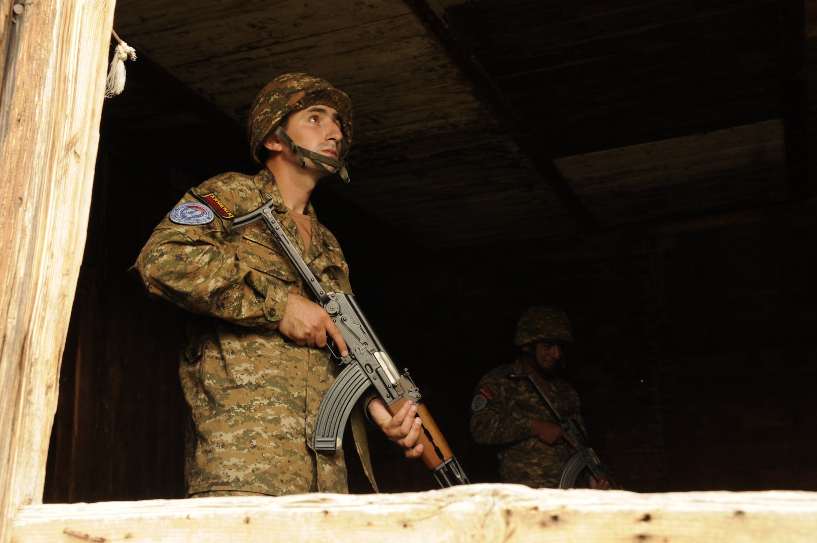 Armenian soldiers complete clearing a room in a target house at the Krivolak Training Area, North Macedonia, May 25, 2012. Soldiers participating in Exercise Cooperative Lancer had the opportunity to train from the classroom, to the sand tables and then incorporate that training out into the field. (U.S. Air National Guard photo by Staff Sgt. Sarah Mattison)