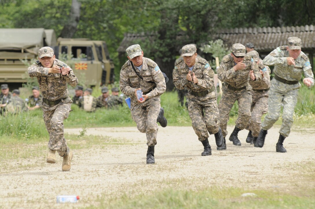 Kazakhstan soldiers participate in cordon and search drills at Camp Strella, Krivolak, Republic of North Macedonia, May 24, 2012. Kazakhstan was one of more than 25 countries participating in Exercises Cooperative Longbow and Cooperative Lancer. (U.S. Air National Guard photo by Staff Sgt. Sarah Mattison)
