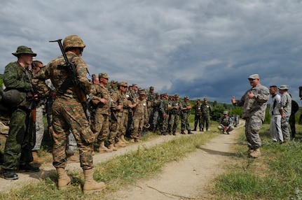 First Lt. Scott Mathewson from the Vermont Army National Guard, provides After Action Reporting (AAR) comments to Armenian, Belarusian, North Macedonian and Vermont Army National Guard soldiers at the Krivolak Training Area, the former Yugoslav Republic of Macedonia, May 25, 2012. The Soldiers had the opportunity to train together during Exercise Cooperative Lancer, improving capabilities and fostering international partnerships. (U.S. Air National Guard photo by Senior Airman Sarah Mattison)