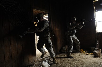 U.S. soldiers from the Vermont Army National Guard clear a room in a target house at the Krivolak Training Area, Republic of North Macedonia, May 25, 2012. Soldiers participating in Exercise Cooperative Lancer had the opportunity to train from the classroom, to the sand tables and then incorporate that training out into the field. (U.S. Air National Guard photo by Senior Airman Sarah Mattison)