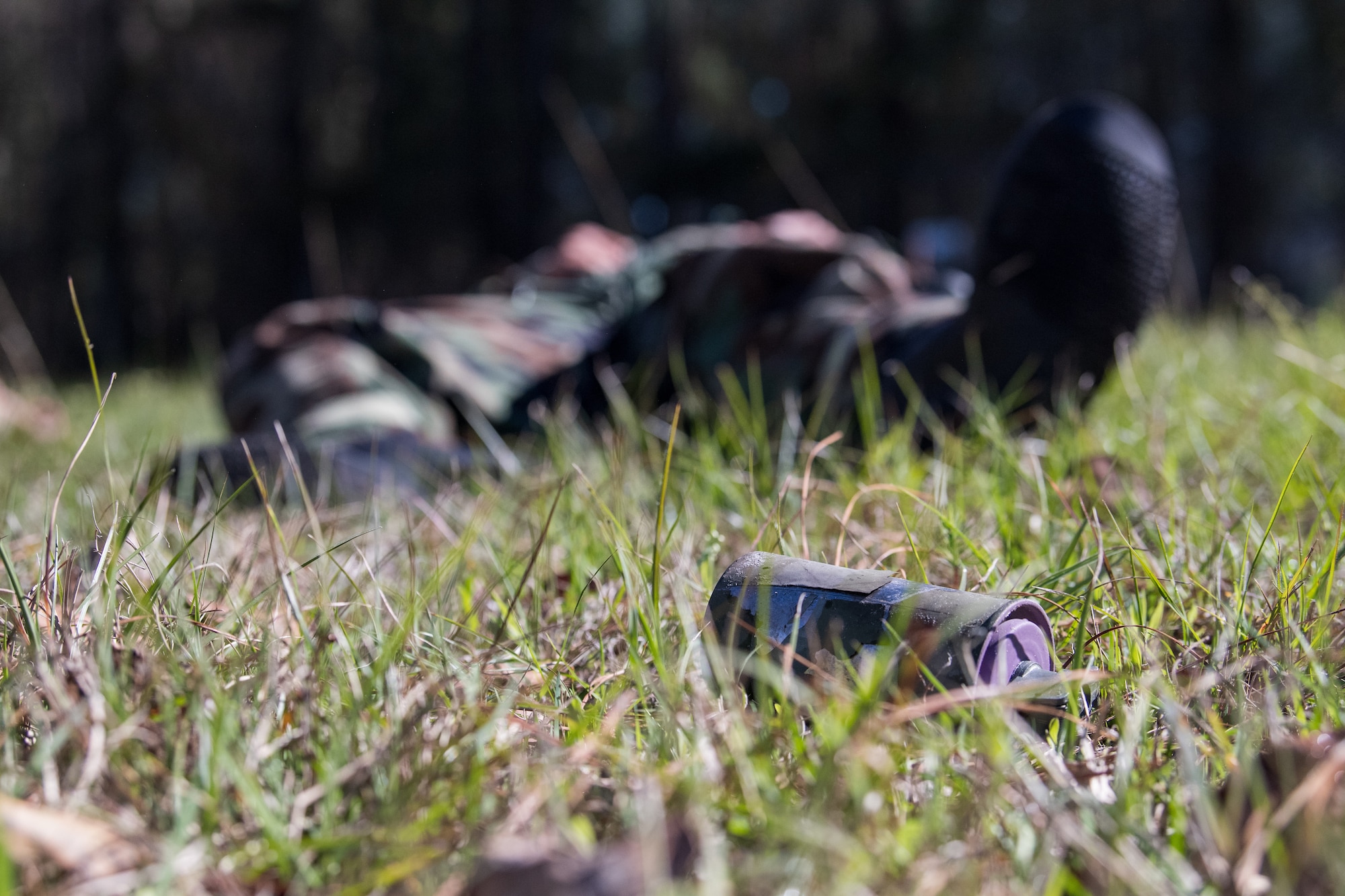 Photo of a simulated explosive device sitting on the ground