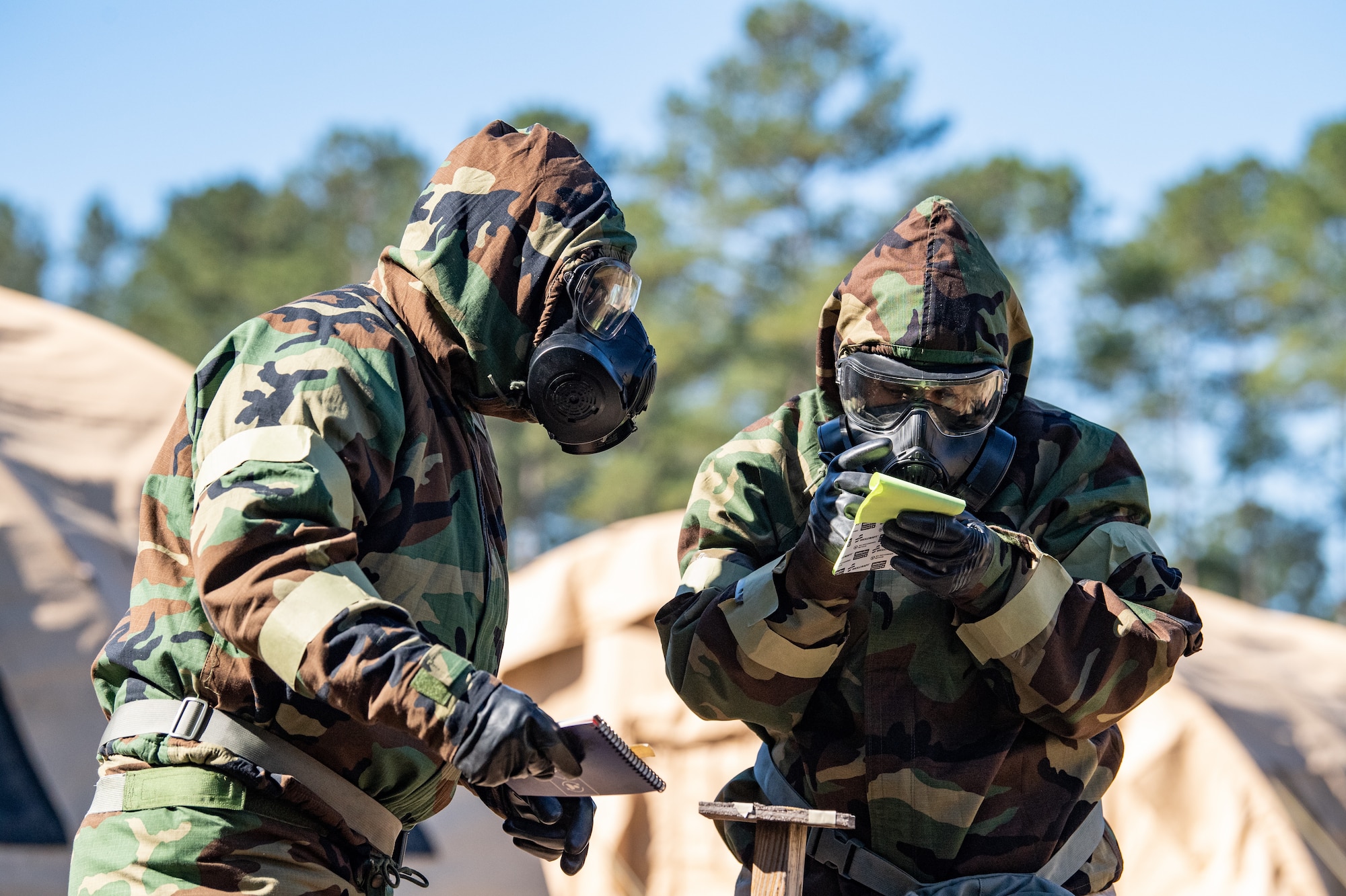 Photo of Airmen checking chemical detection paper