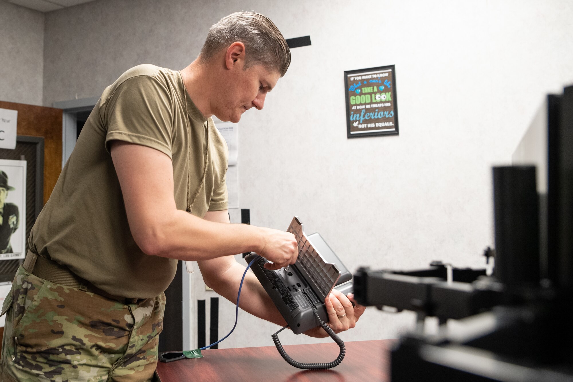 U.S. Air Force Tech. Sgt. Daniel Greene, 23rd Wing air staff member, establishes communication devices in the Wing Operations Center for exercise Ready Tiger 22-01 at Moody Air Force Base, Georgia, Feb. 24, 2022. During Ready Tiger, the 505th Command and Control Wing acted as the simulated Air Operations Center. (U.S. Air Force photo by Andrea Jenkins.)