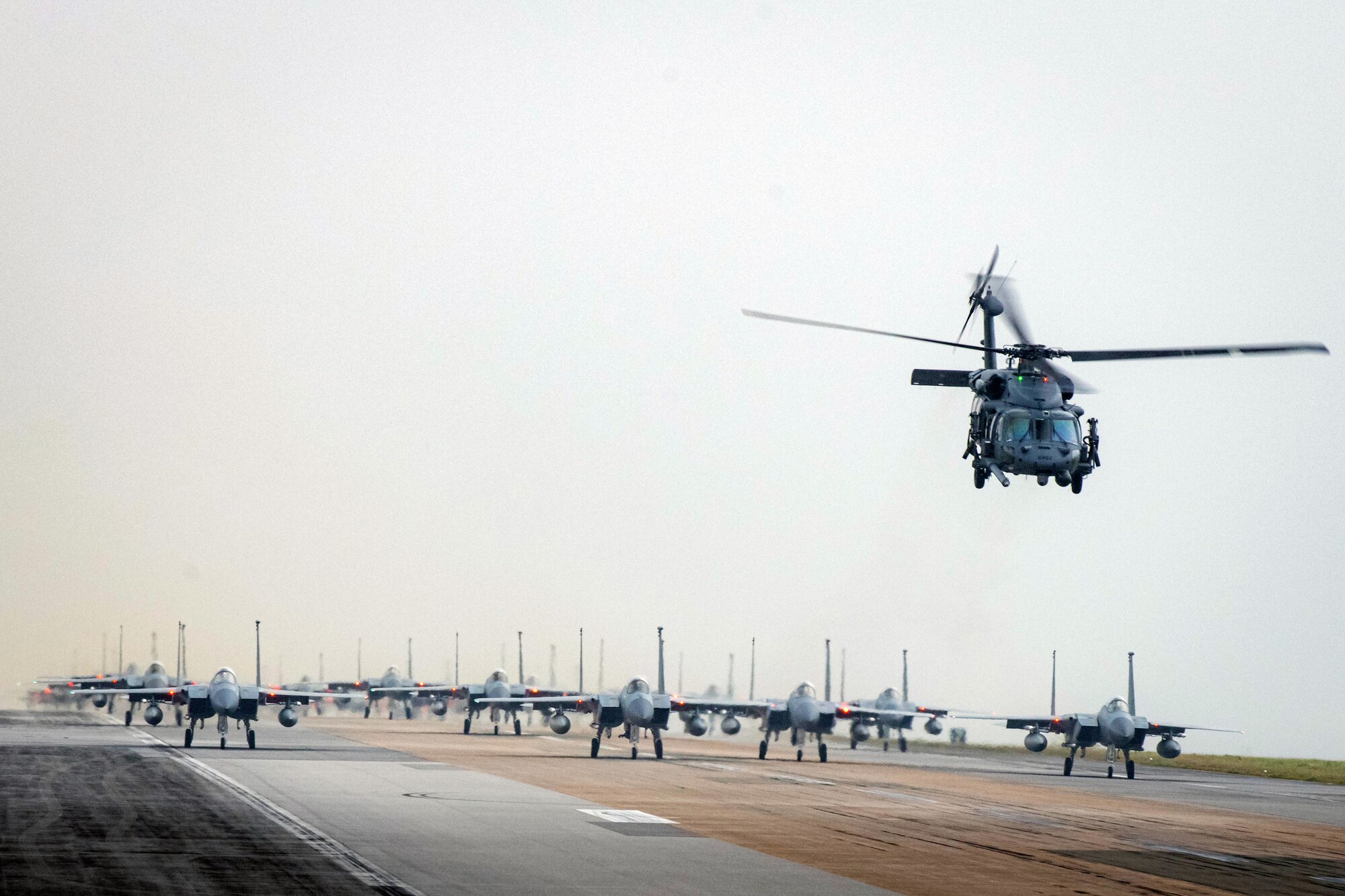 A formation of F-15C/D Eagles assigned to the 44th and 67th Fighter Squadrons taxi on the flightline