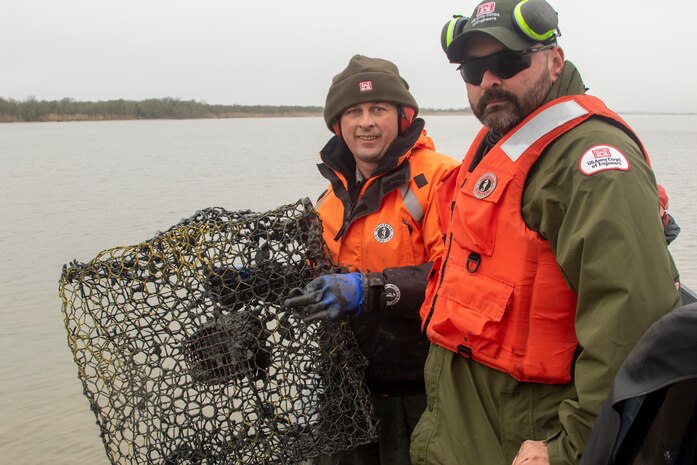 WALLISVILLE, Texas -- USACE Galveston District Natural Resource Specialists Mark Tyson (left) and Brandon Moehrle collect abandoned crab traps at the Wallisville Lake Project.

Abandoned crab traps can entrap and kill aquatic and terrestrial wildlife and also pose a threat to recreational boaters on the lake by damaging their outboard motors.

The crab trap round-up is just one of the many ways USACE promotes environmental stewardship, regulates waterways, and manages natural resources.