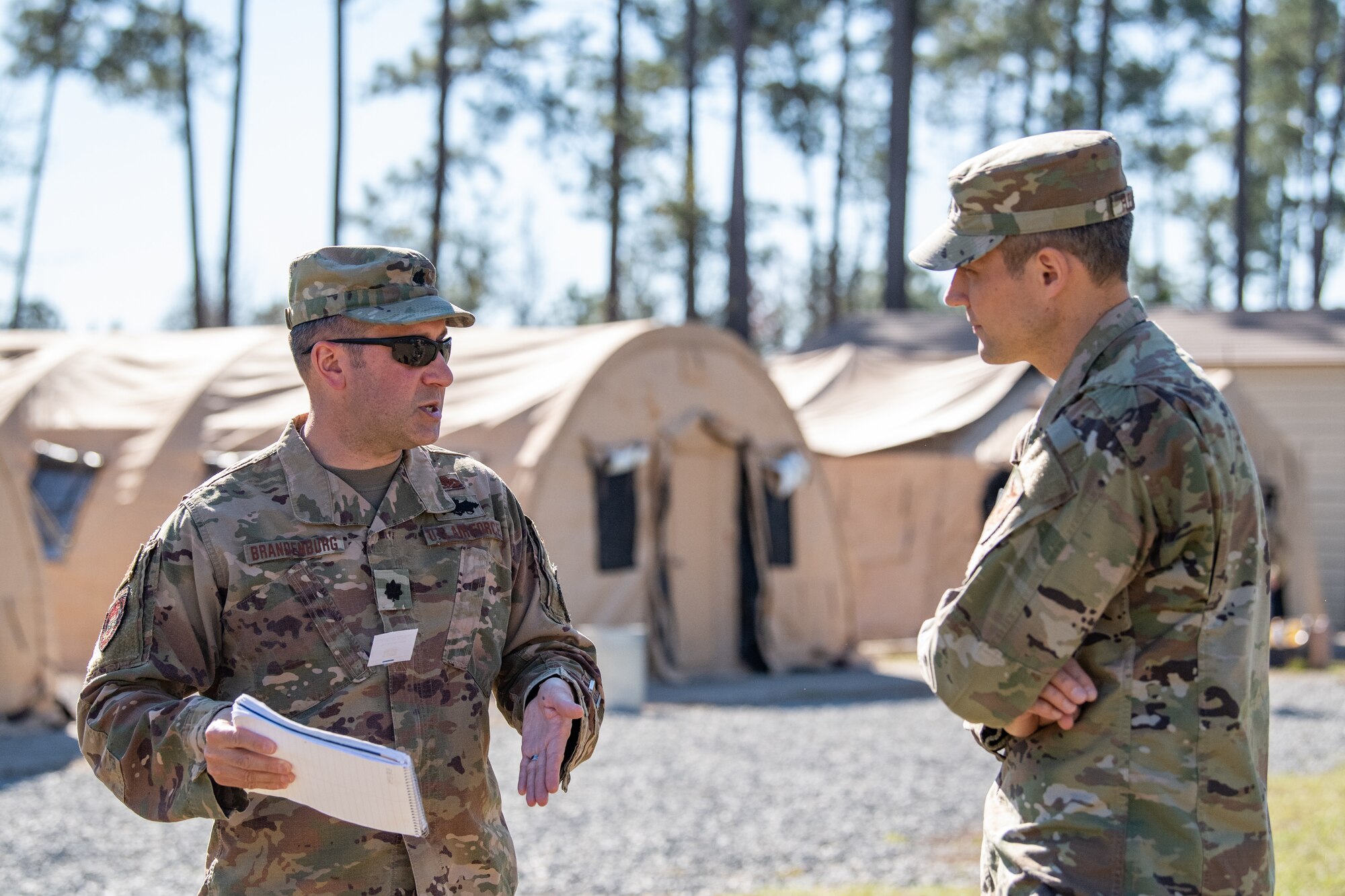 Two service members chat