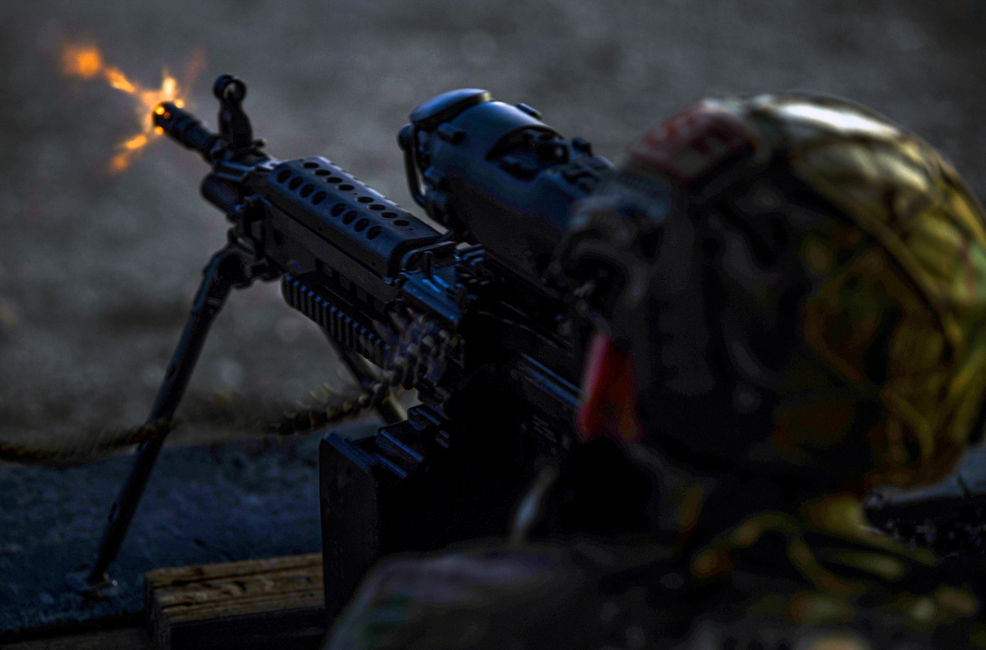 An Airman with the 9th Security Forces Squadron fires his weapon