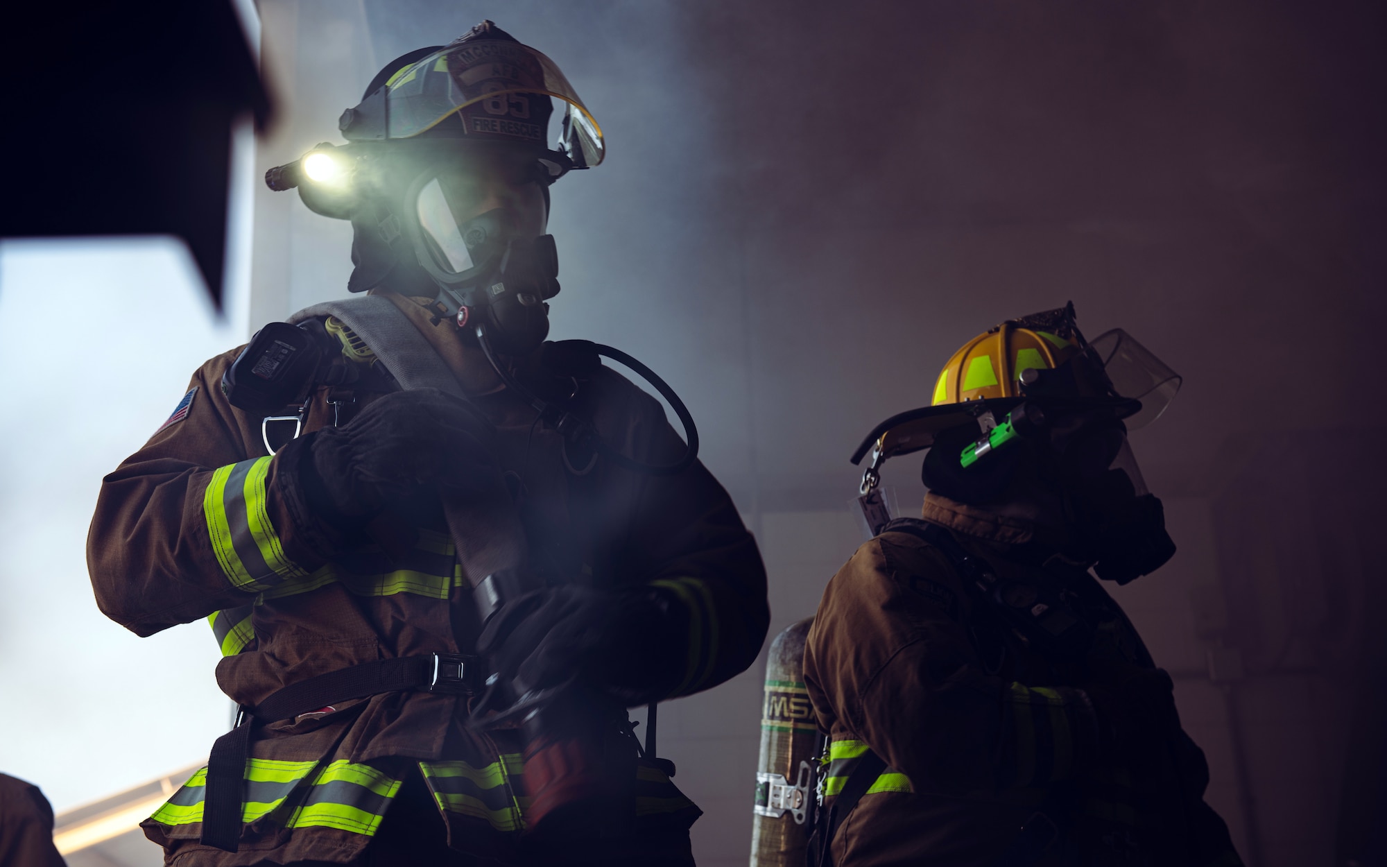 U.S. Air Force firefighters assigned to the 379th Expeditionary Civil Engineer Squadron simulate putting out a structure fire