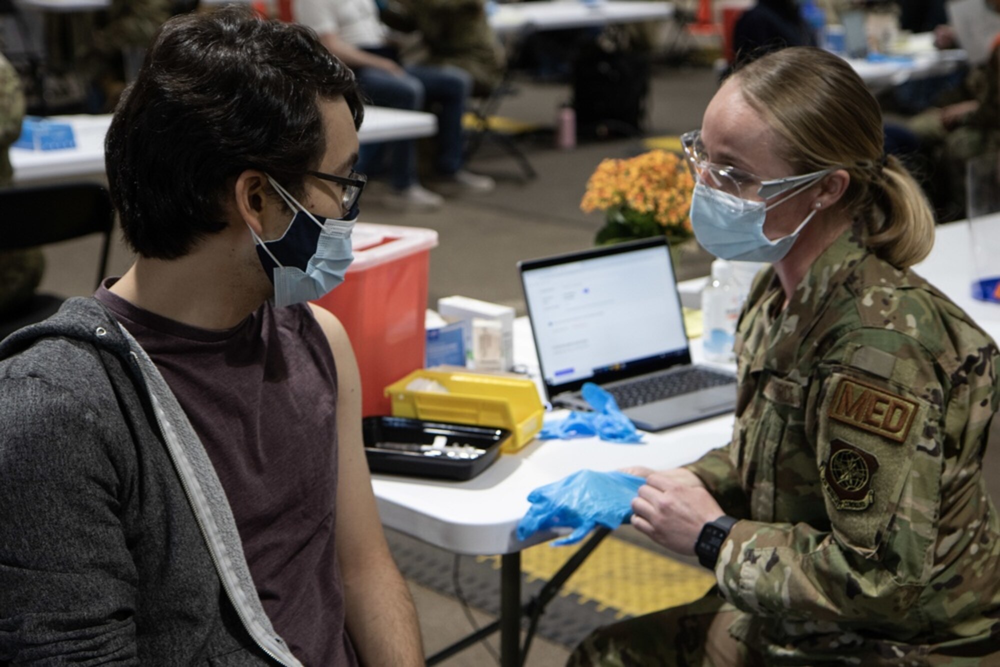 U.S. Air Force Senior Airman Daschia Lawrence, with the 92nd Health Care Operations Squadron, administers the 10,000th vaccine since the start of operations at the Community Vaccination Center (CVC) in St. Paul, Minnesota, on April 16, 2021. Marc Ho, a data engineer based in Minneapolis, received the 10,000th COVID vaccine at the CVC, which is now completely operational and welcoming the St. Paul community. U.S. Northern Command, through U.S. Army North, remains committed to providing continued, flexible Department of Defense support to the Federal Emergency Management Agency as part of the whole-of-government response to COVID-19.