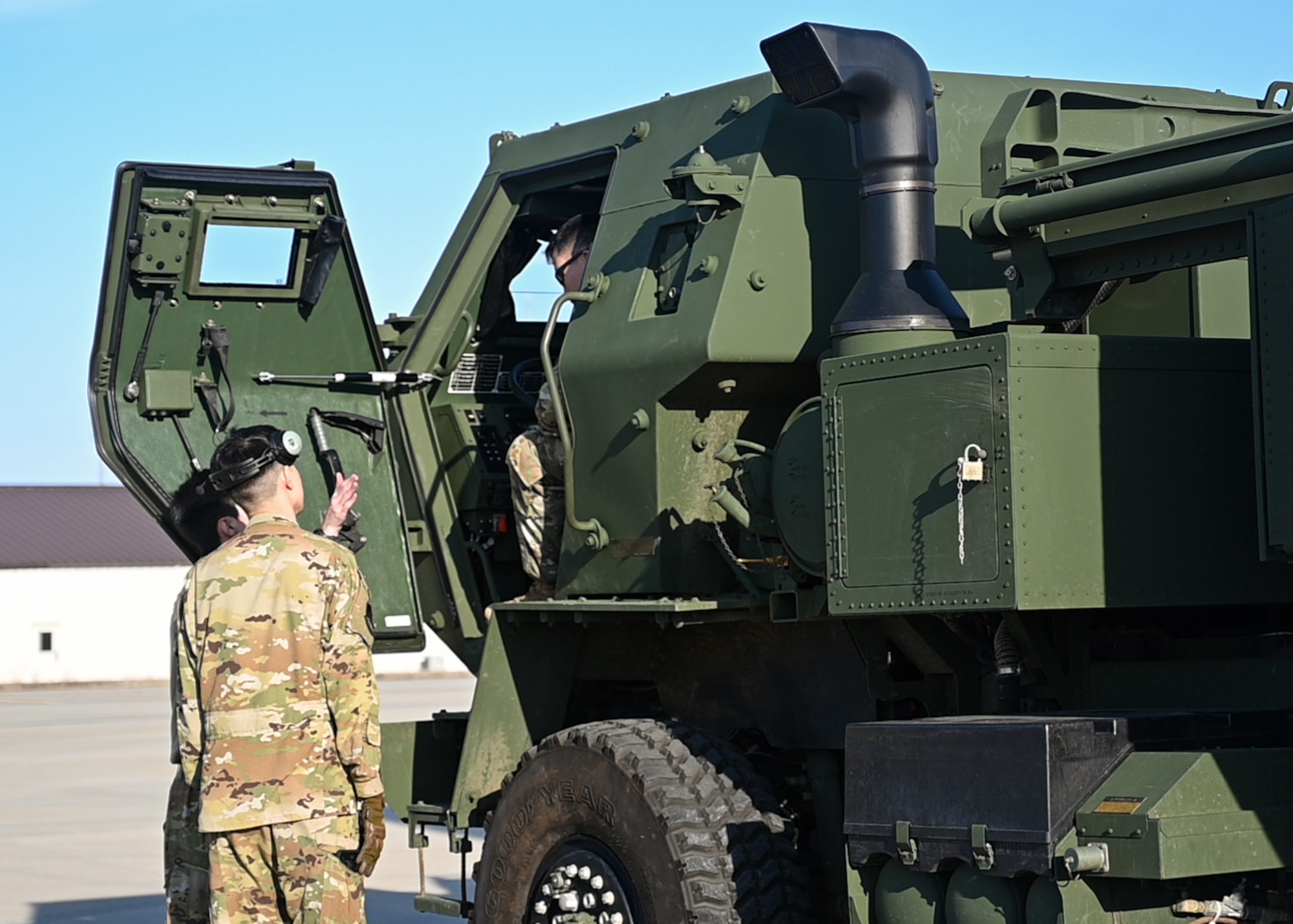 Loadmasters from the 41st Airlift Squadron prepare to load a High Mobility Artillery Rocket System onto a C-130J Super Hercules