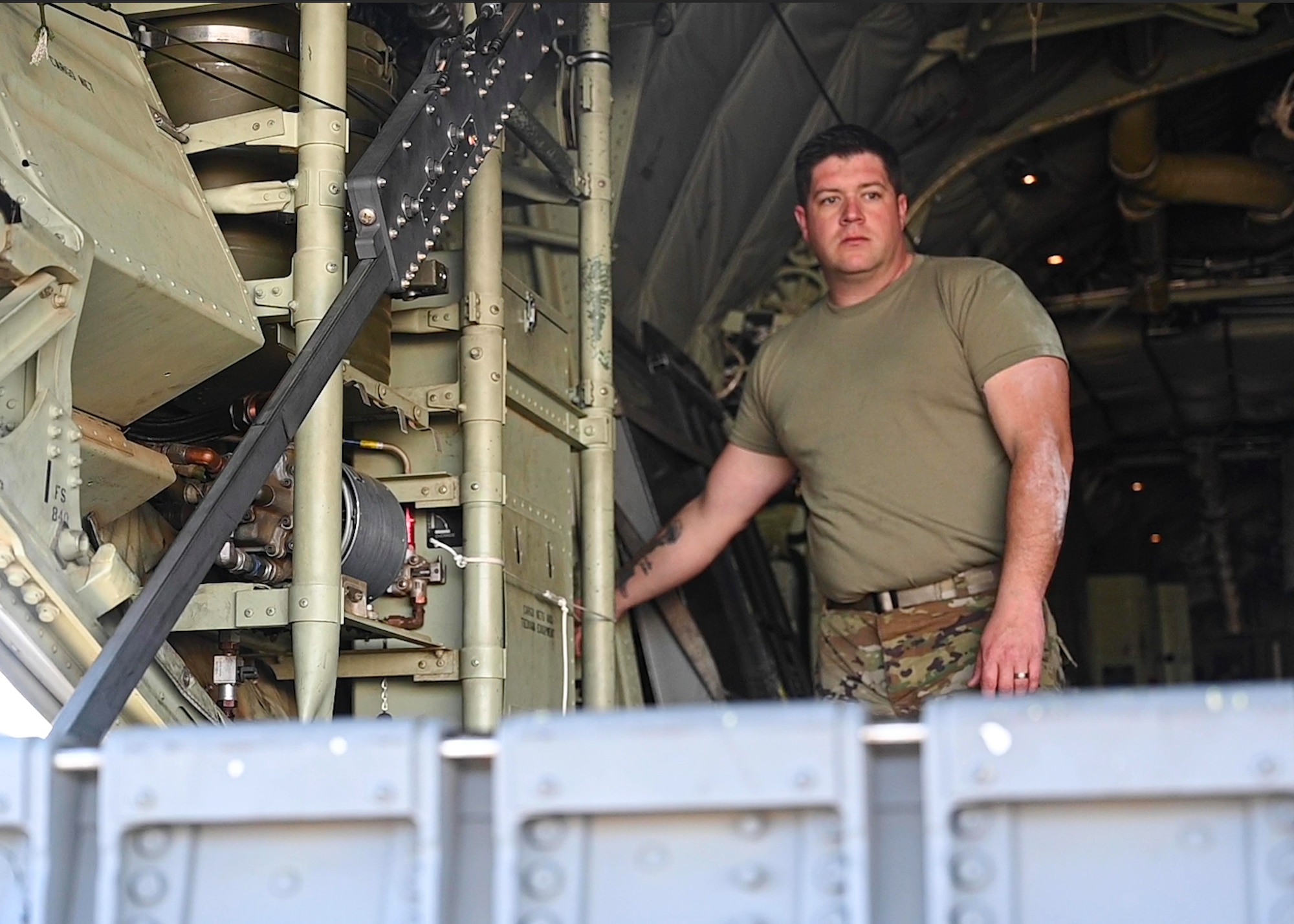 An Airman from the 19th Aircraft Maintenance Squadron closes the ramp door on a C-130J Super Hercules