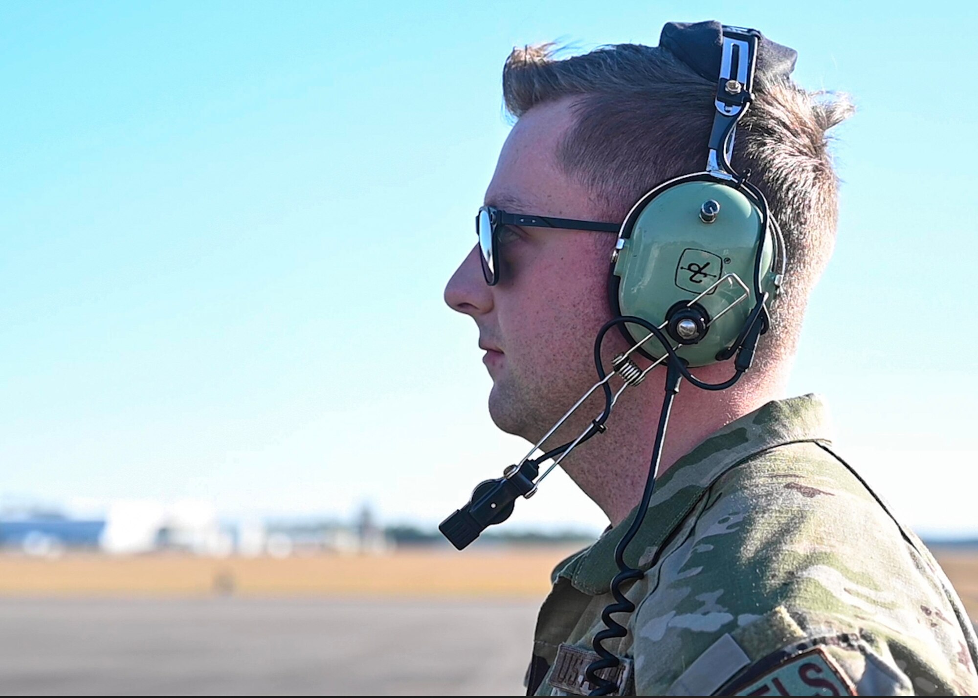 An Airman from the 19th Aircraft Maintenance Squadron watches as a C-130J Super Hercules