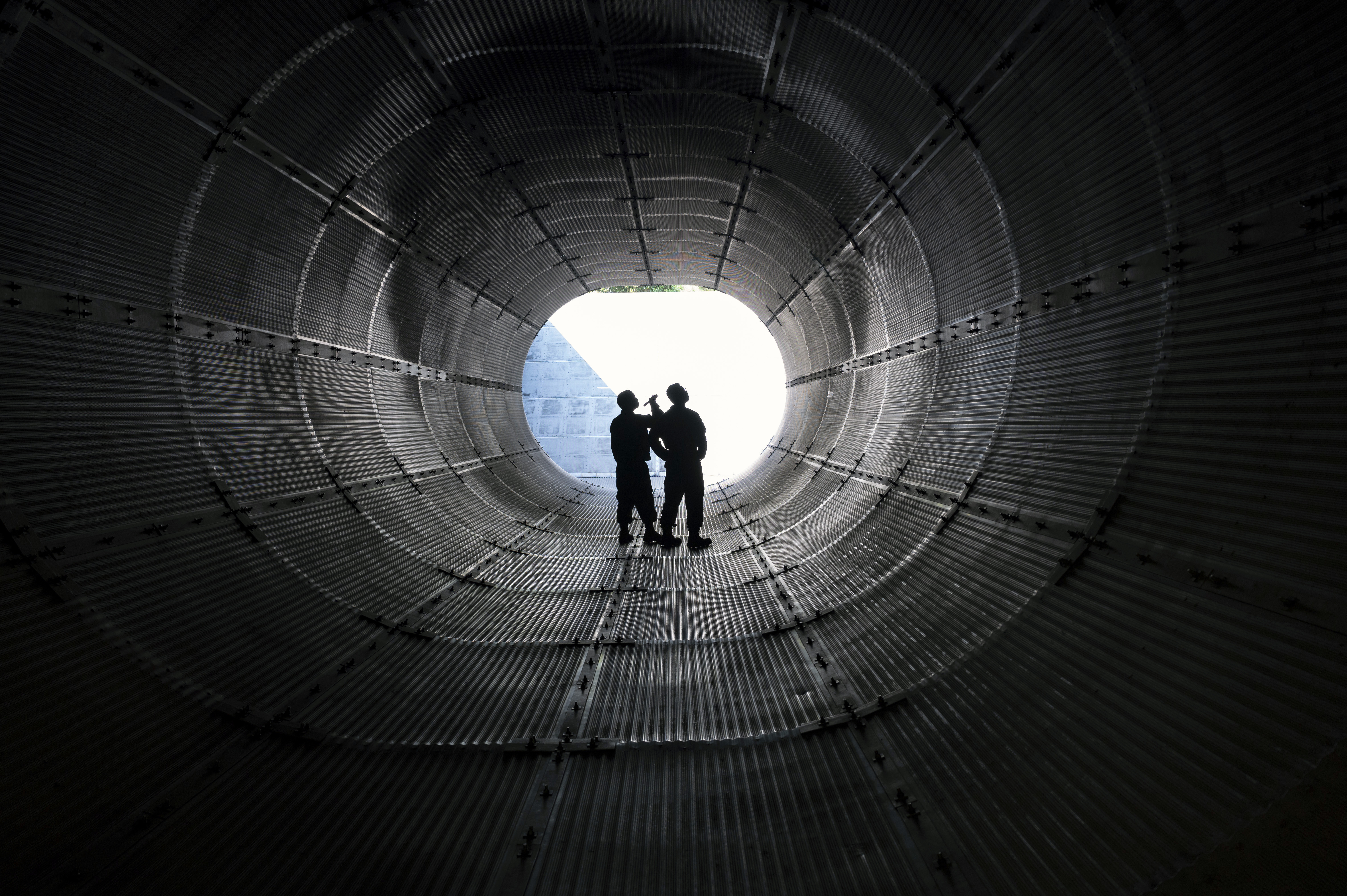 Airmen assigned to the 20th Component Maintenance Squadron engine test cell inspect the inside of an exhaust tube