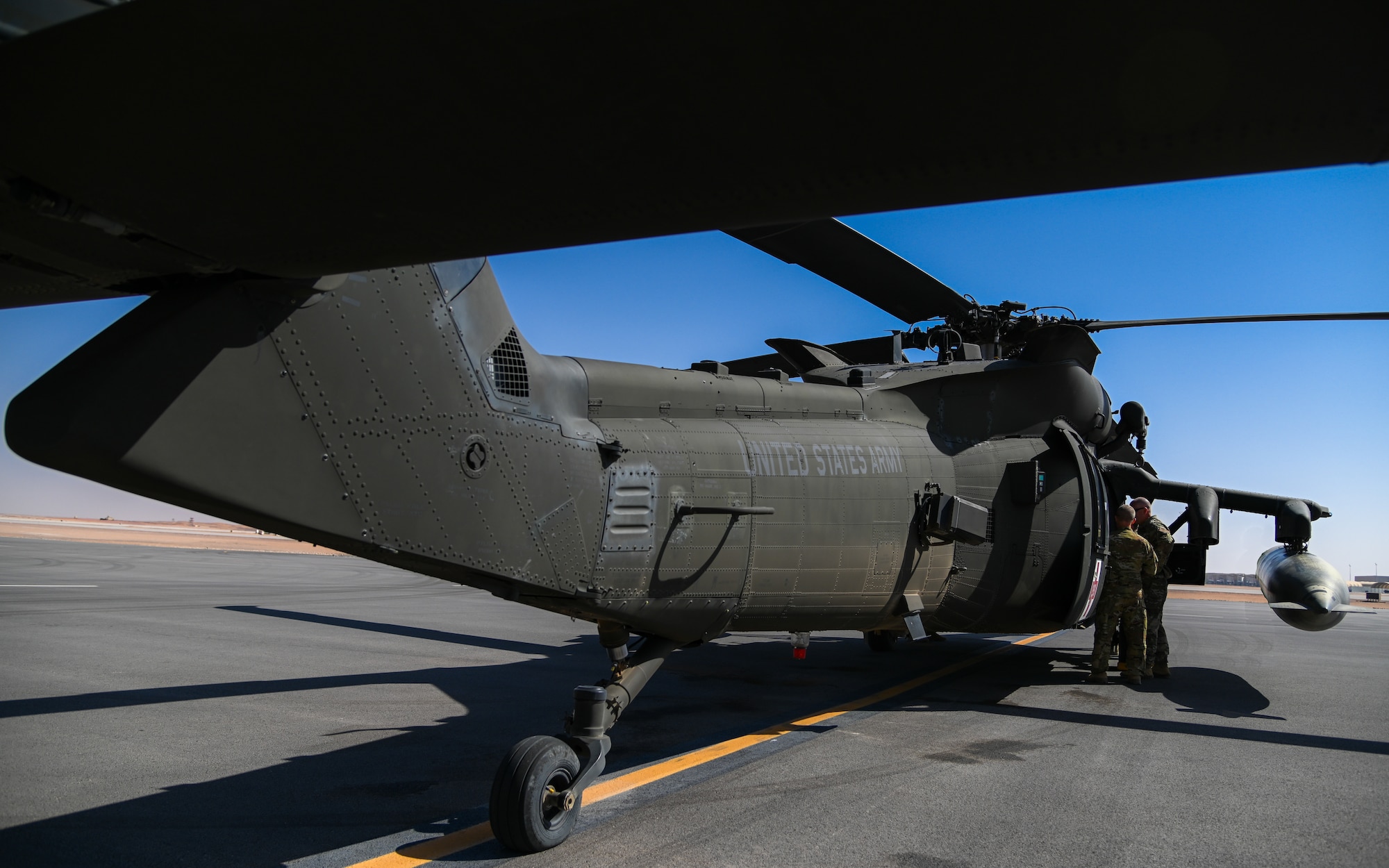 Leaders from the 378th Air Expeditionary Wing receive a tour of the HH-60M Black Hawk from the U.S. Army Soldiers of Task Force Longhorn at Prince Sultan Air Base, Kingdom of Saudi Arabia, Feb. 23, 2022. TF Longhorn is the premiere medical evacuation team for the 378th AEW. (U.S. Air Force photo by Staff Sgt. Christina Graves)