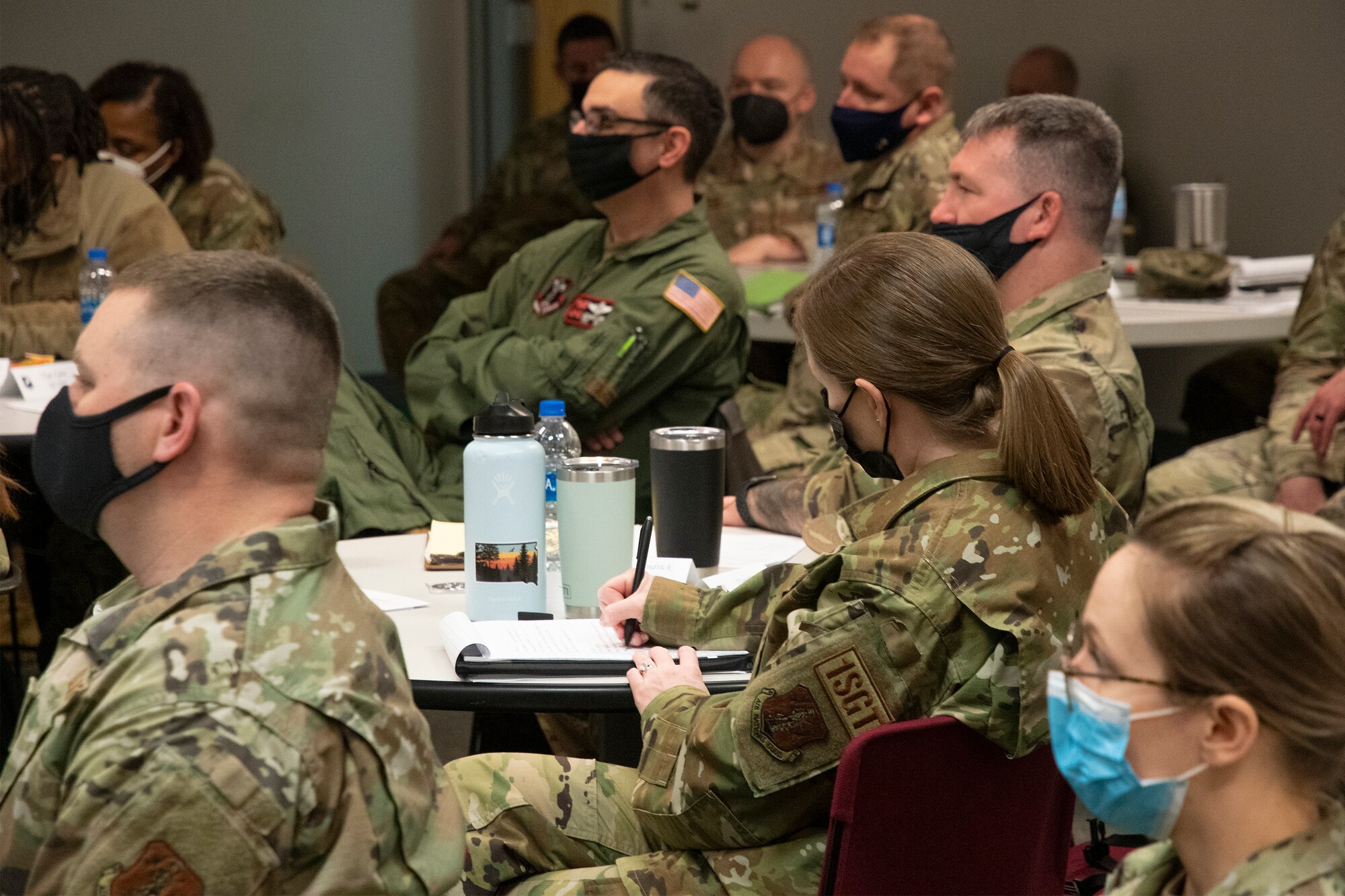 U.S. Air Force Senior Master Sgt. Nichole Gruber, 114th Fighter Wing first sergeant, takes notes during the Additional Duty First Sergeant Seminar at Whiteman Air Force Base, Missouri, Feb. 8, 2022. Noncommissioned officers from 17 different states took part in the seminar to learn about and understand the roles and responsibilities of additional duty first sergeants. (U.S. Air National Guard photo by Airman 1st Class Kelly C. Ferguson)