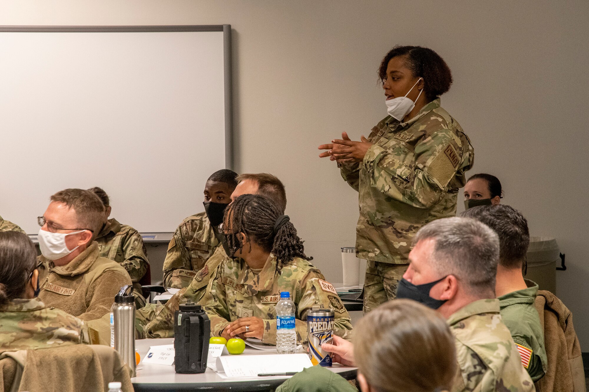 U.S. Air Force Tech. Sgt. Tierra Washington, 113th Civil Engineering Squadron first sergeant, poses a question in a class during the Additional Duty First Sergeant Seminar at Whiteman Air Force Base, Missouri, Feb. 9, 2022. Noncommissioned officers from 17 different states took part in the 131st Bomb Wing-led seminar to learn about and understand the roles and responsibilities of additional duty first sergeants. (U.S. Air National Guard photo by Airman 1st Class Kelly C. Ferguson)