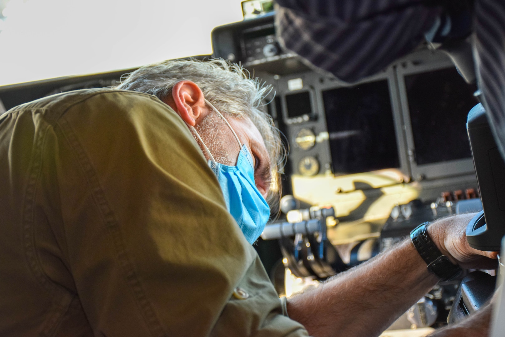 Jeffrey Hudson, Airmen Accommodation Laboratory contractor, secures a tripod to mount a portable coordinate measuring machine inside a C-5M Super Galaxy flight deck, at Joint Base San Antonio-Lackland, Texas, Feb. 28, 2022. This was one of several steps the contractors conducted before taking a 3D representation of the flight deck of a C-5M. (U.S. Air Force photo by Airman Mark Colmenares)