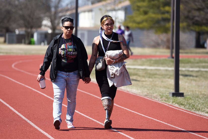 U.S. Air Force Airman 1st Class Martha Magallon Ochoa, 316th Wing Legal Judge Advocate, left, and Samantha Magallon Ochoa, Marine veteran, walk together at the Women’s History Month awareness walk on Joint Base Andrews, Md., March 5, 2022.
