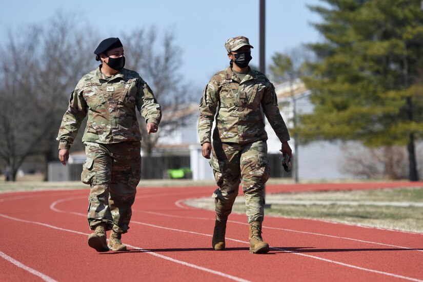 U.S. Air Force Tech. Sgts. Allison Littlejohn, 459th Security Forces, left, and Alicia Fulford 459th Security Forces Squadron members, walk together at the Women’s History Month awareness walk on Joint Base Andrews, Md., March 5, 2022.