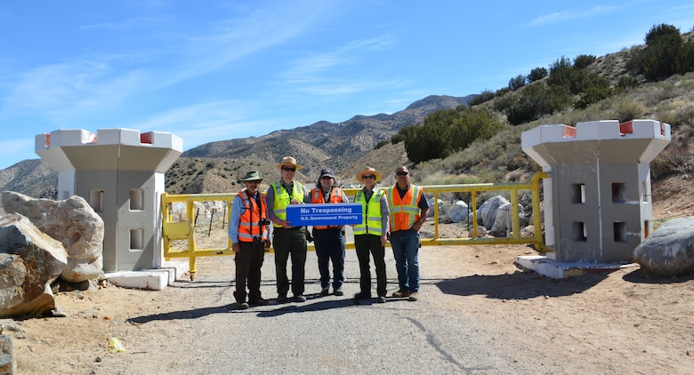 U.S. Army Corps of Engineers LA District park rangers and engineers pose with the latest “No Trespassing” sign March 2 at the main entrance to the Mojave River Dam in San Bernardino County, California. The signs are meant to keep off-road vehicles from driving into endangered habitat areas near the dam. Pictured from left to right, are: Jon Rishi, biologist with the Corps’ LA District; park rangers Henry Csaposs, Mai Linh Lawrence Skropanic and Connie Chan Le, and Carlos Camacho, a construction engineer with the Corps’ LA District.