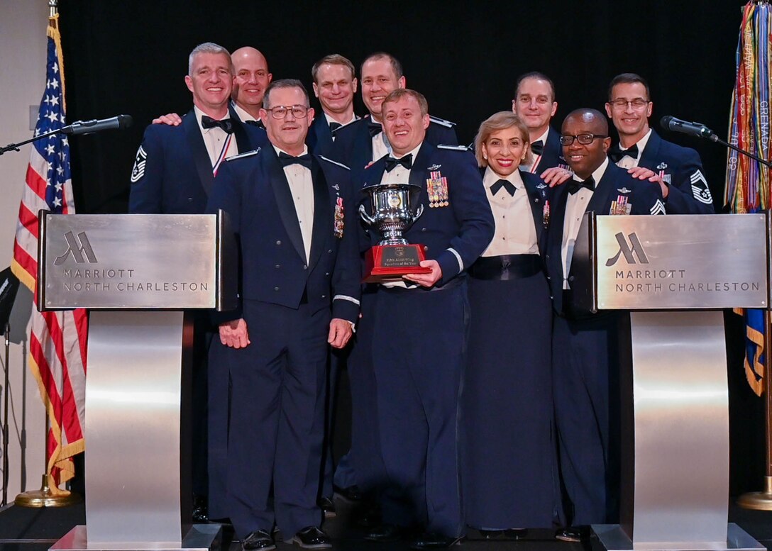 The 300th Airlift Squadron, Joint Base Charleston, South Carolina, is presented with a squadron of the year trophy March 5, 2022 at the second annual Awards Gala. The 315th Airlift Wing hosted its second annual Awards Gala to highlight the accomplishments of the wing and its members. (U.S. Air Force photo by Senior Airman William Brugge)