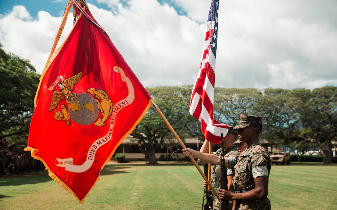U.S. Marines with 3d Marine Littoral Regiment, 3d Marine Division present arms during the redesignation ceremony of 3d Marines to 3d MLR aboard Marine Corps Base Hawaii, March 3, 2022. The 3d MLR will serve as a key enabler for joint, allied, and partnered forces, will integrate with naval forces, and will enable multi-domain maneuver and fires within contested spaces.  The transition of 3d Marines to 3d MLR is in accordance with Force Design 2030 and one of the first major steps to facilitating a shift as the Marine Corps divests in legacy capabilities and builds a force that is optimized for operations envisioned within the Commandant’s Planning Guidance. (U.S. Marine Corps photo by Cpl. Patrick King)