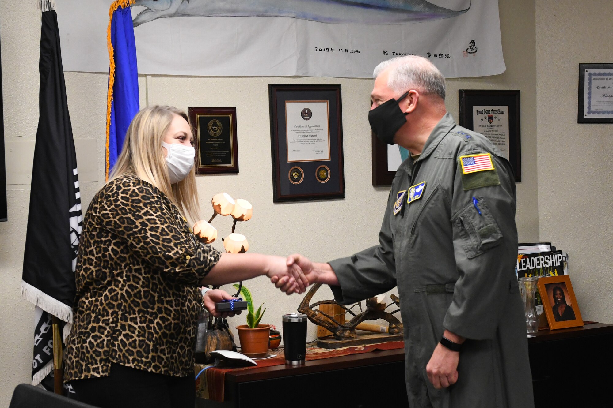 Lt. Gen. Ricky Rupp congratulates Leanne Oatman on her Joan Orr Air Force Spouse of the Year award nomination.