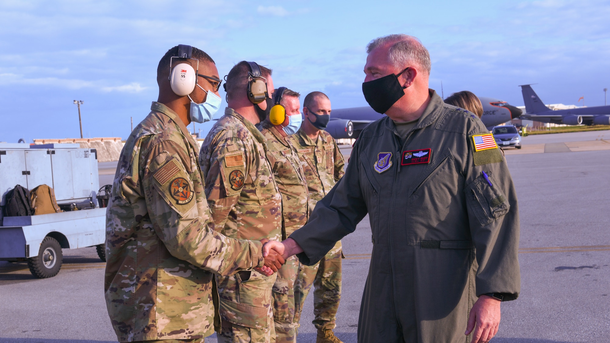 Lt. Gen. Ricky Rupp congratulates Airmen.