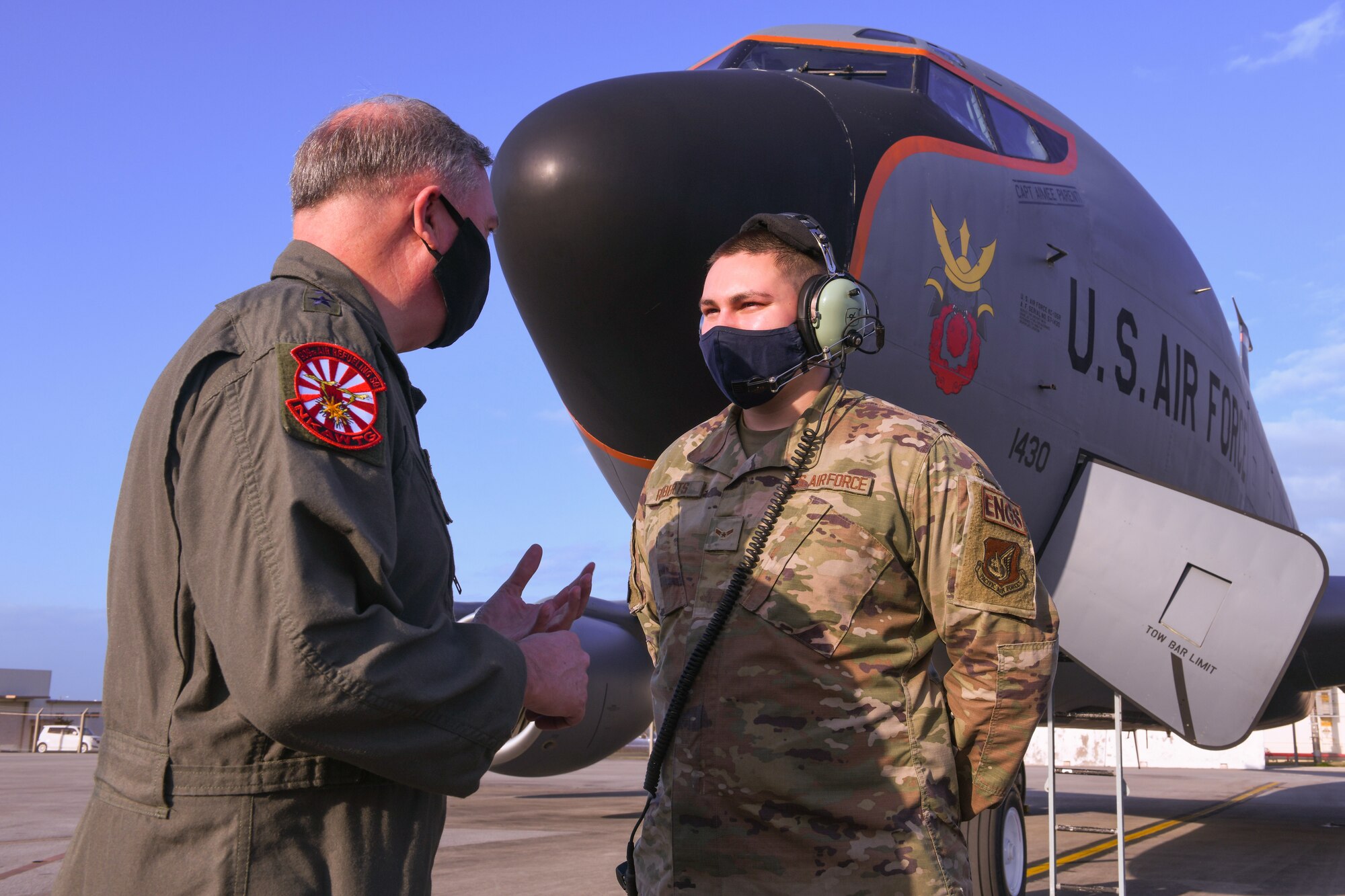 Lt. Gen. Ricky Rupp congratulating airmen.